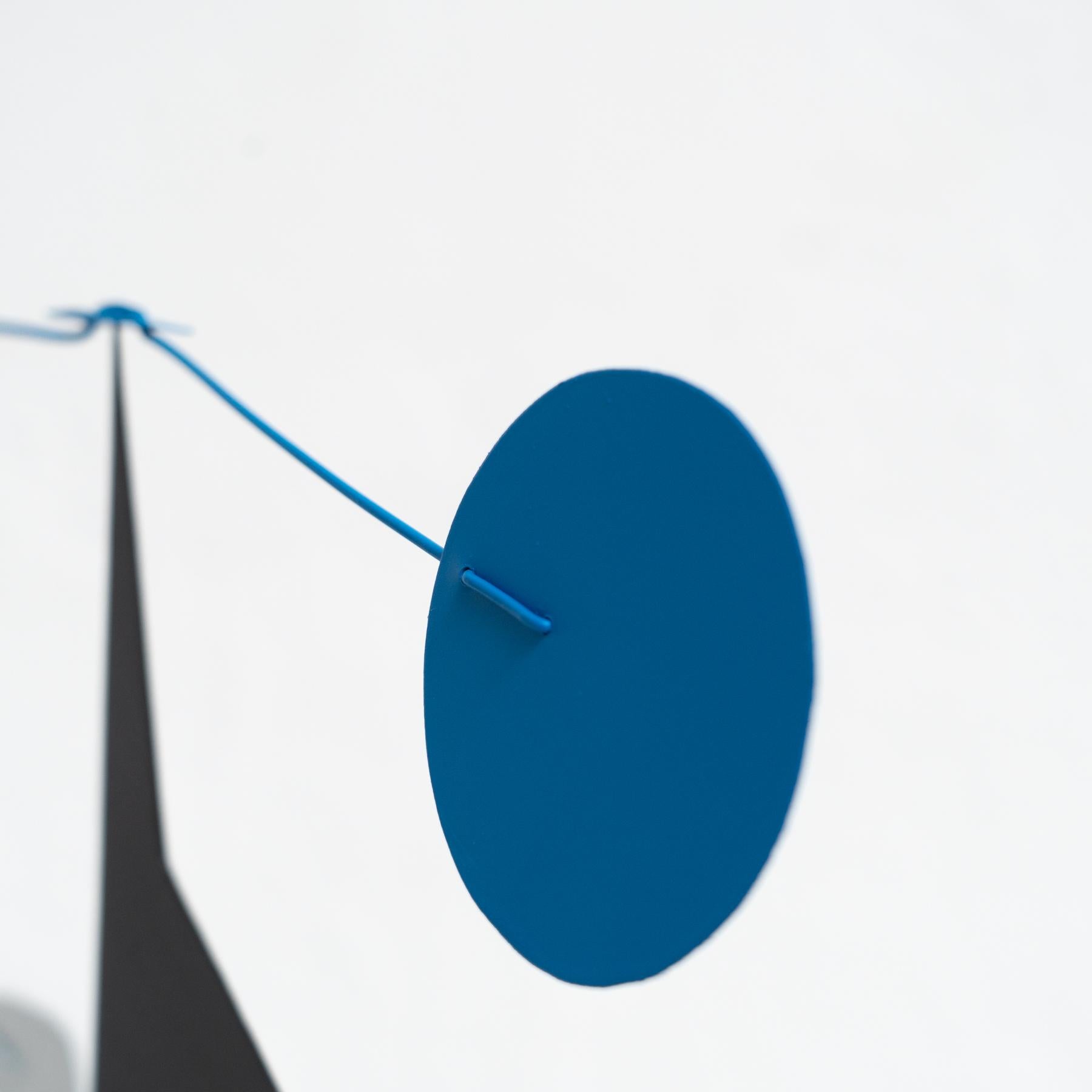 Mesmerizing Kinetics: Iron Sculpture - Painted Motion and Color 3