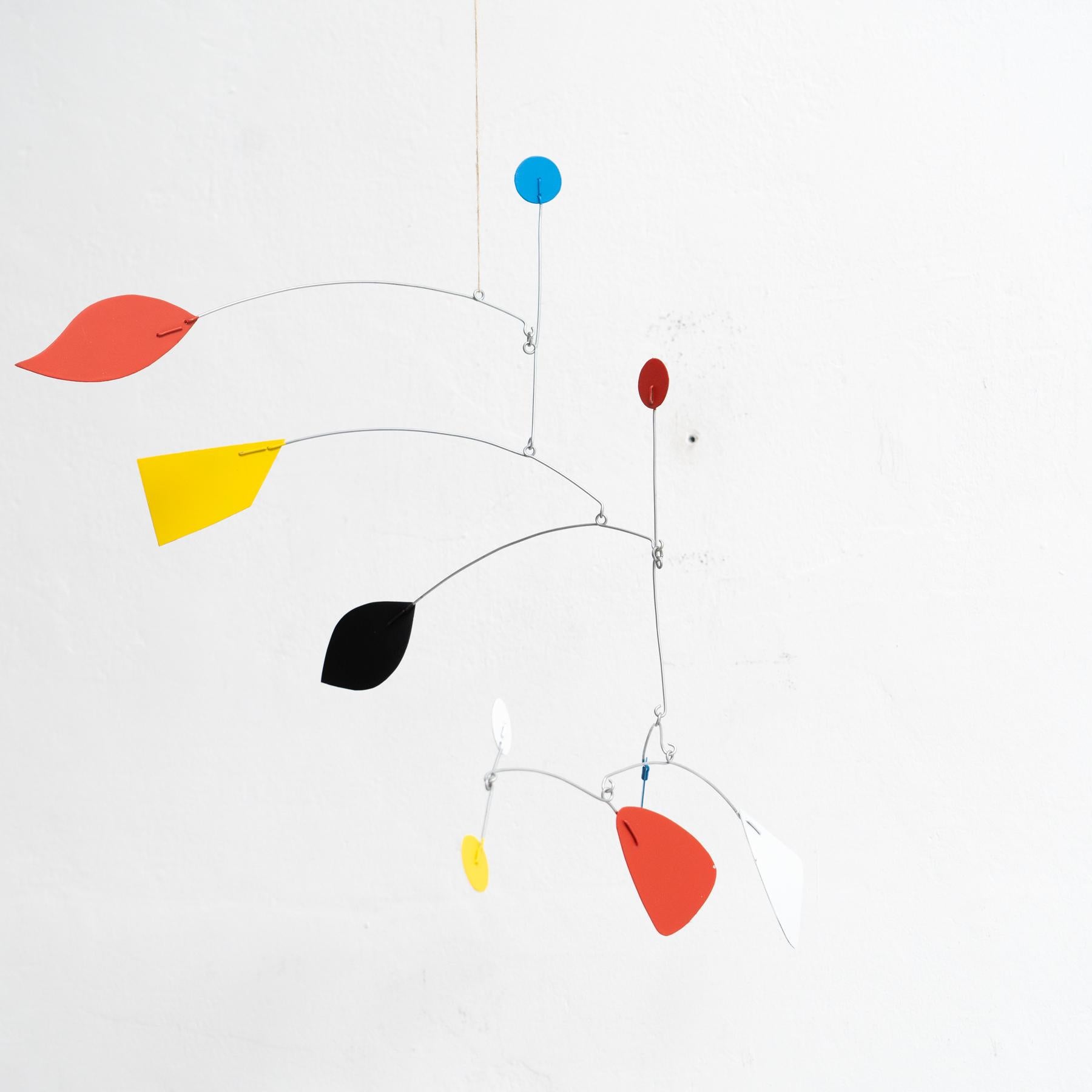 Mesmerizing Kinetics: Iron Sculpture - Painted Motion and Color 4