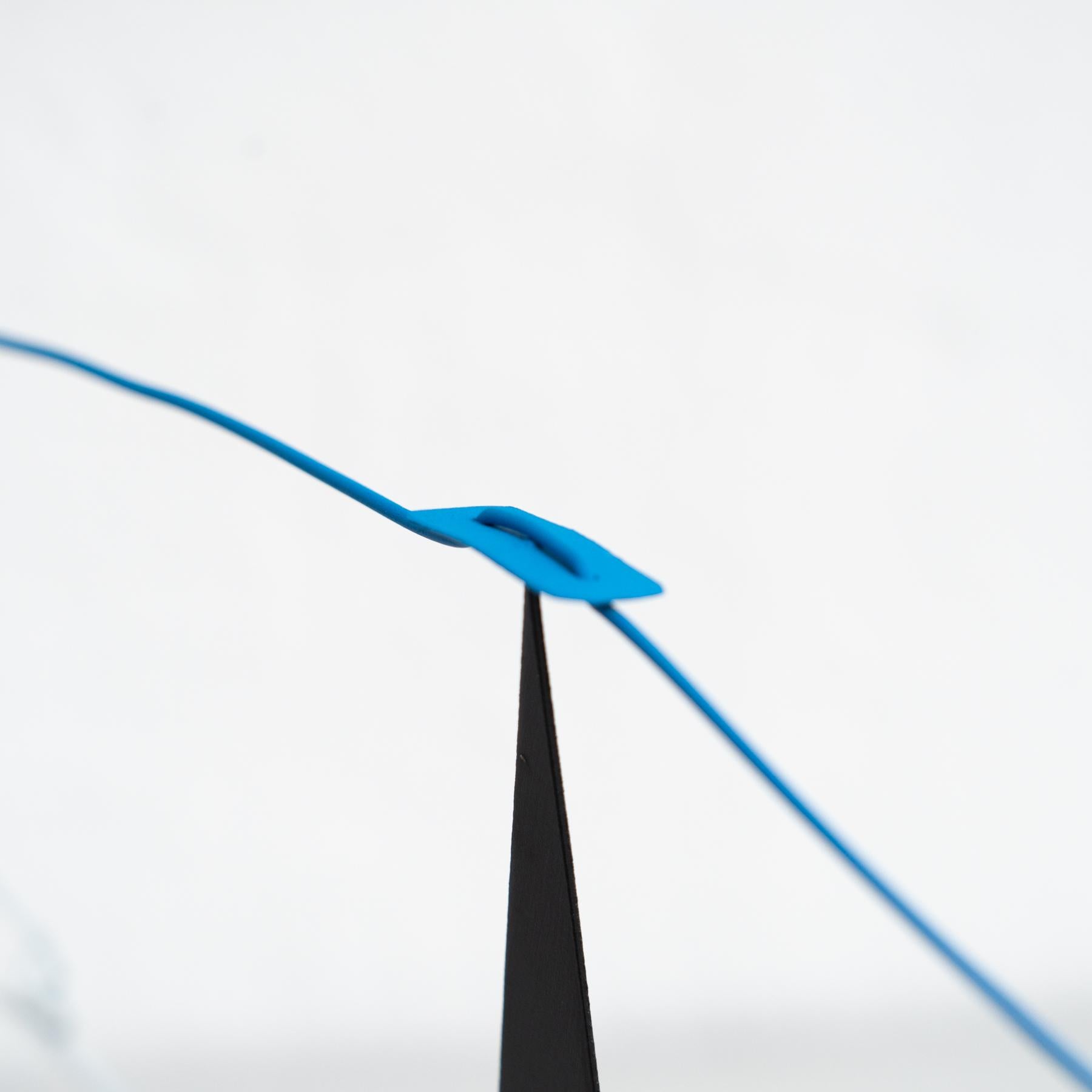 Mesmerizing Kinetics: Iron Sculpture - Painted Motion and Color 5