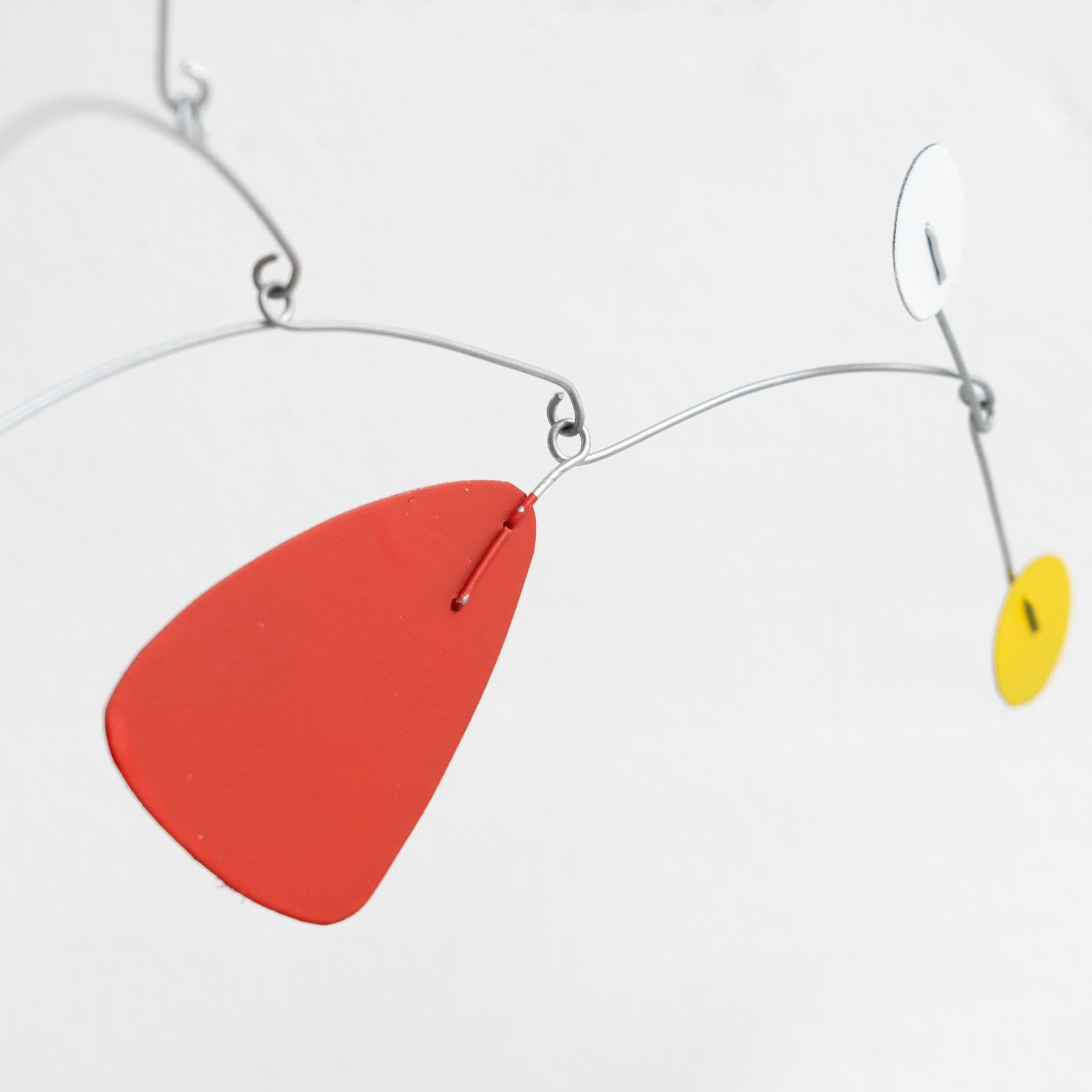 Mesmerizing Kinetics: Iron Sculpture - Painted Motion and Color 6