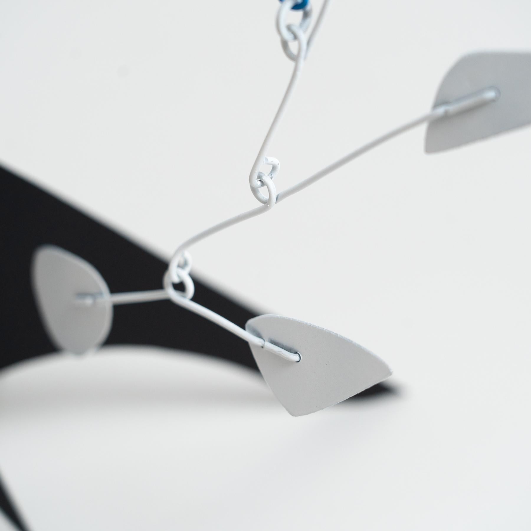 Mesmerizing Kinetics: Iron Sculpture - Painted Motion and Color 7