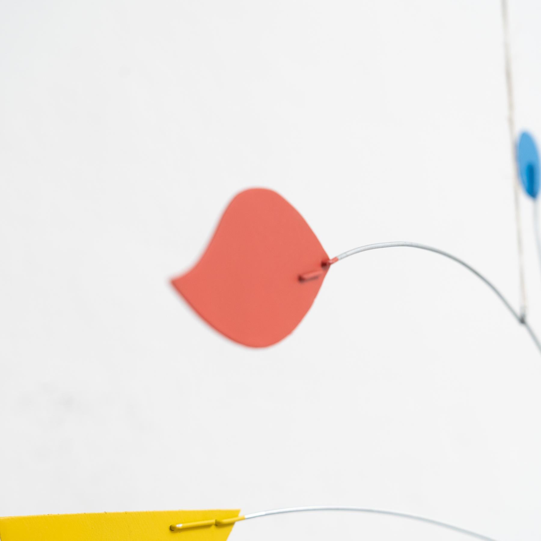 Mesmerizing Kinetics: Iron Sculpture - Painted Motion and Color 9