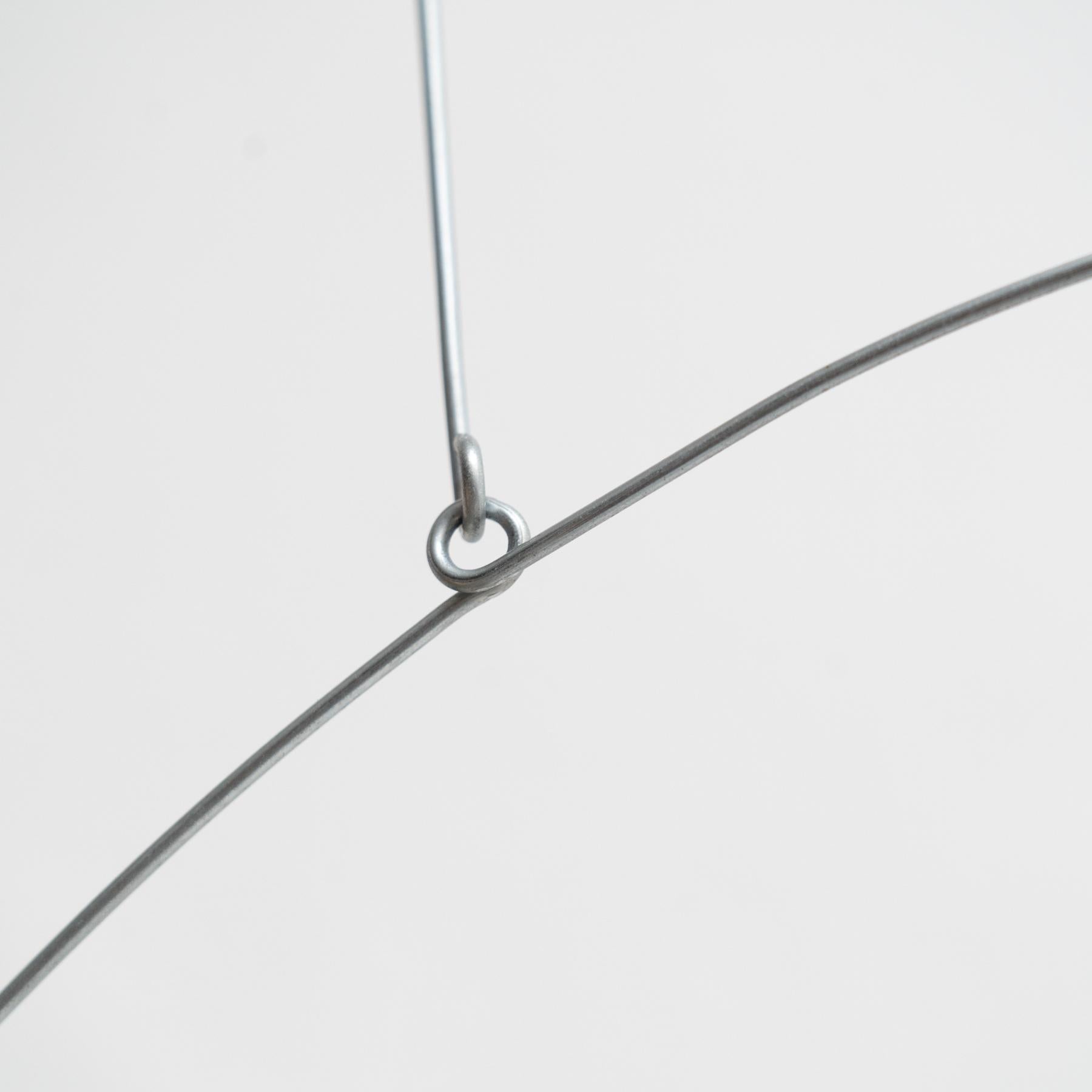 Mesmerizing Kinetics: Iron Sculpture - Painted Motion and Color 11