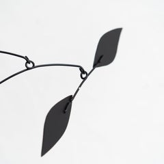 Mesmerizing Kinetics: Iron Sculpture - Painted Motion and Color