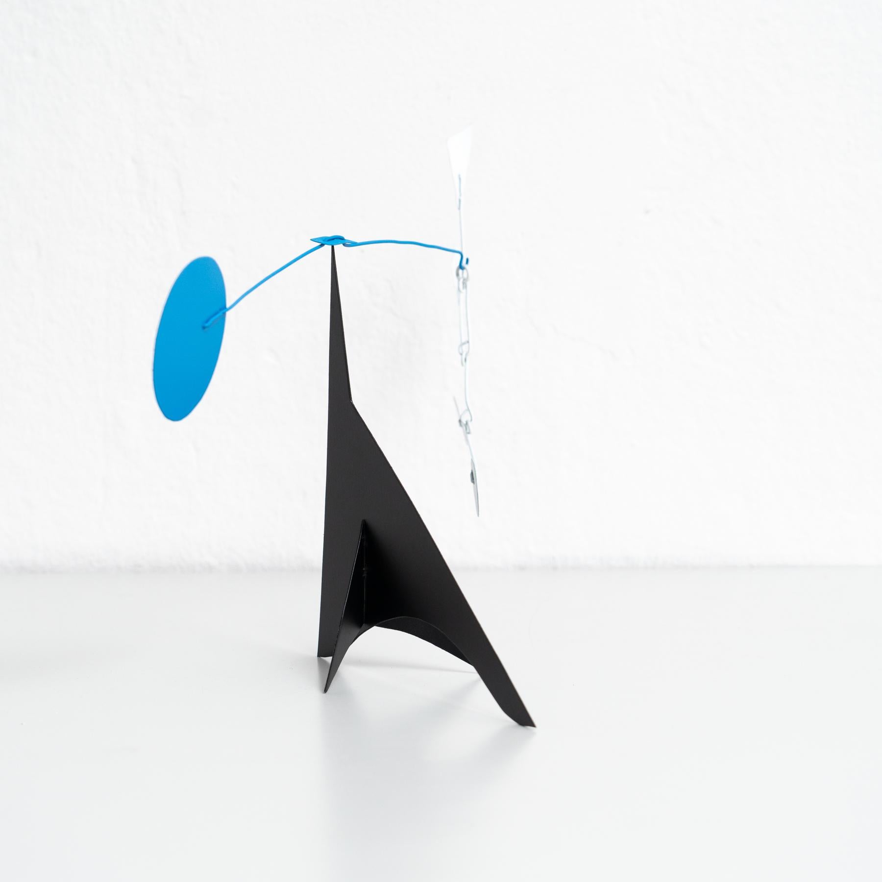 Mesmerizing Kinetics: Iron Sculpture - Painted Motion and Color 1