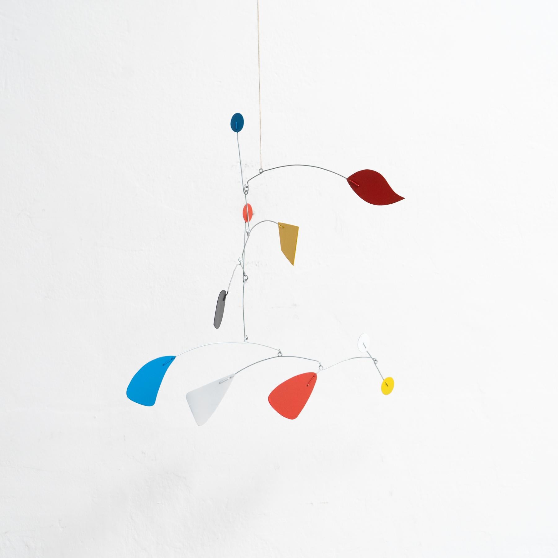 Mesmerizing Kinetics: Iron Sculpture - Painted Motion and Color 1