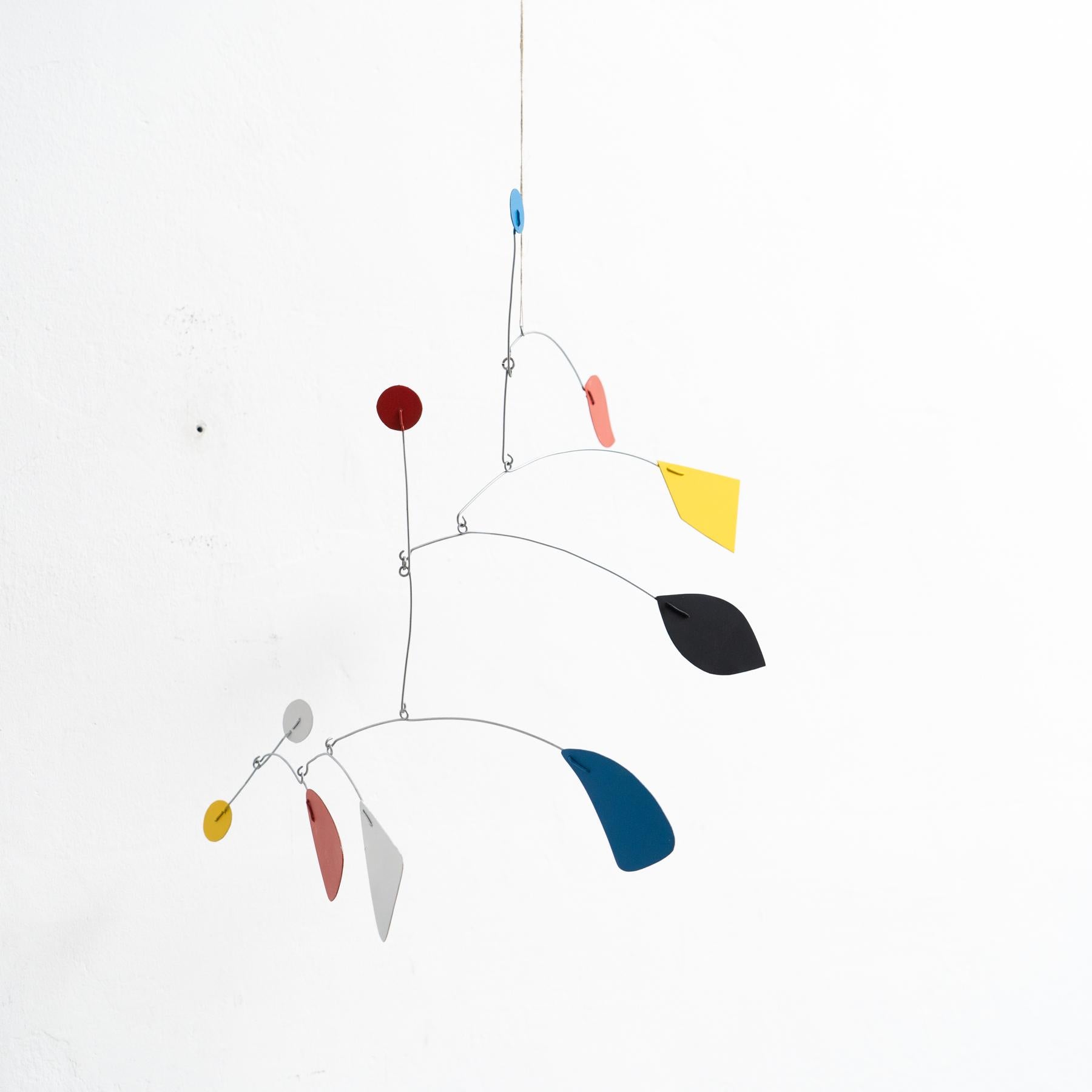 Mesmerizing Kinetics: Iron Sculpture - Painted Motion and Color 2