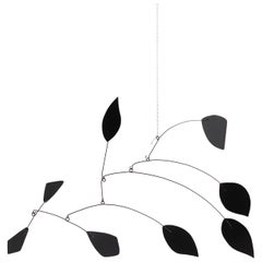 Mesmerizing Kinetics: Iron Sculpture - Painted Motion and Color