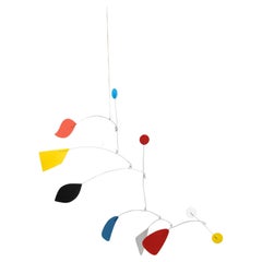 Mesmerizing Kinetics: Iron Sculpture - Painted Motion and Color