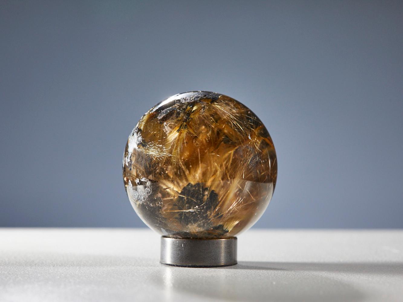 18th Century and Earlier Mesmerizing Quartz Sphere with Golden Rutile Inclusions For Sale