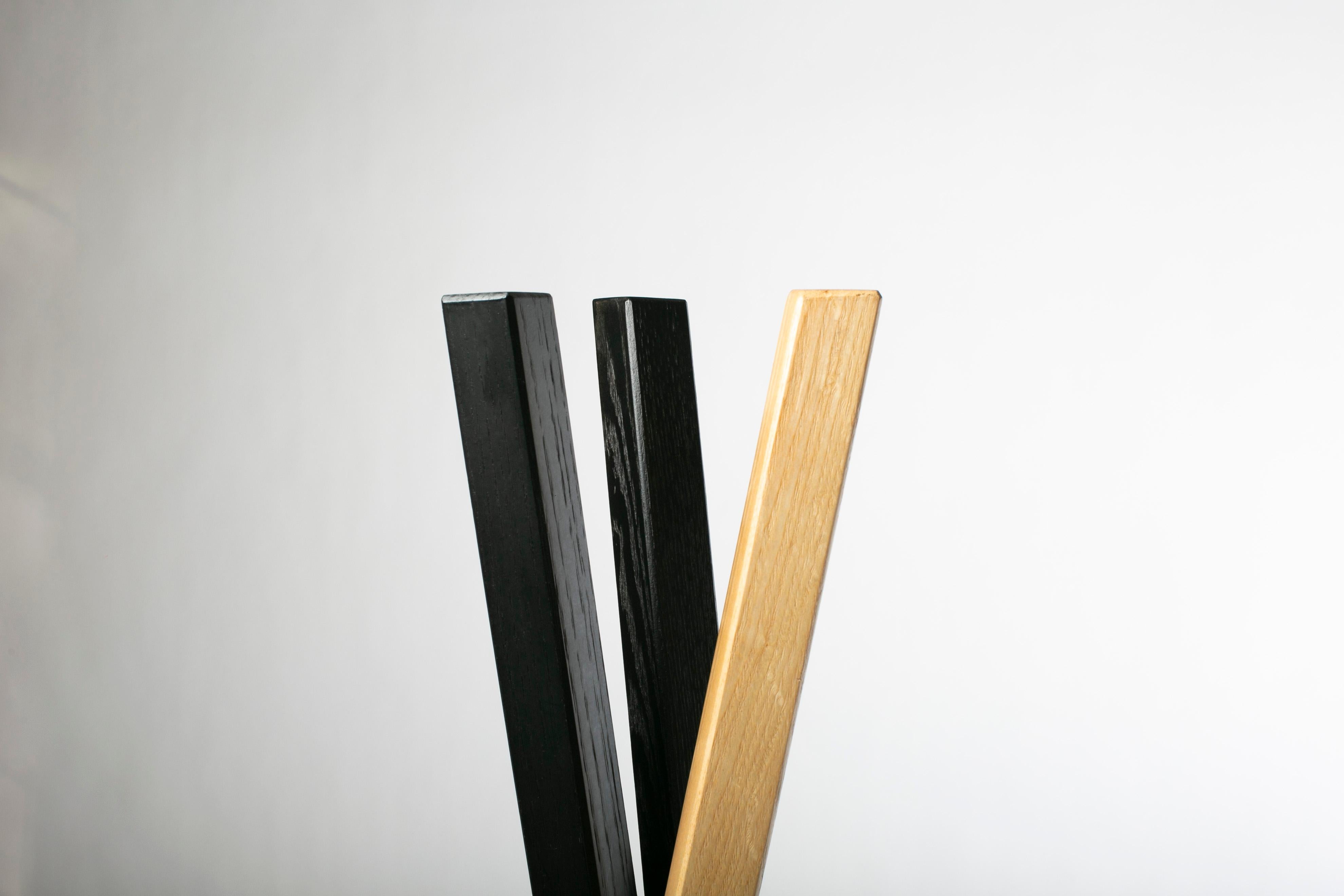 This stand-coat rack it's made from 3 legs that interlace to form an elegant solid hardwood structure that will set the tone of the space it's inhabiting.

Designed by Juskani Alonso Studio. Produced in Mexico City.