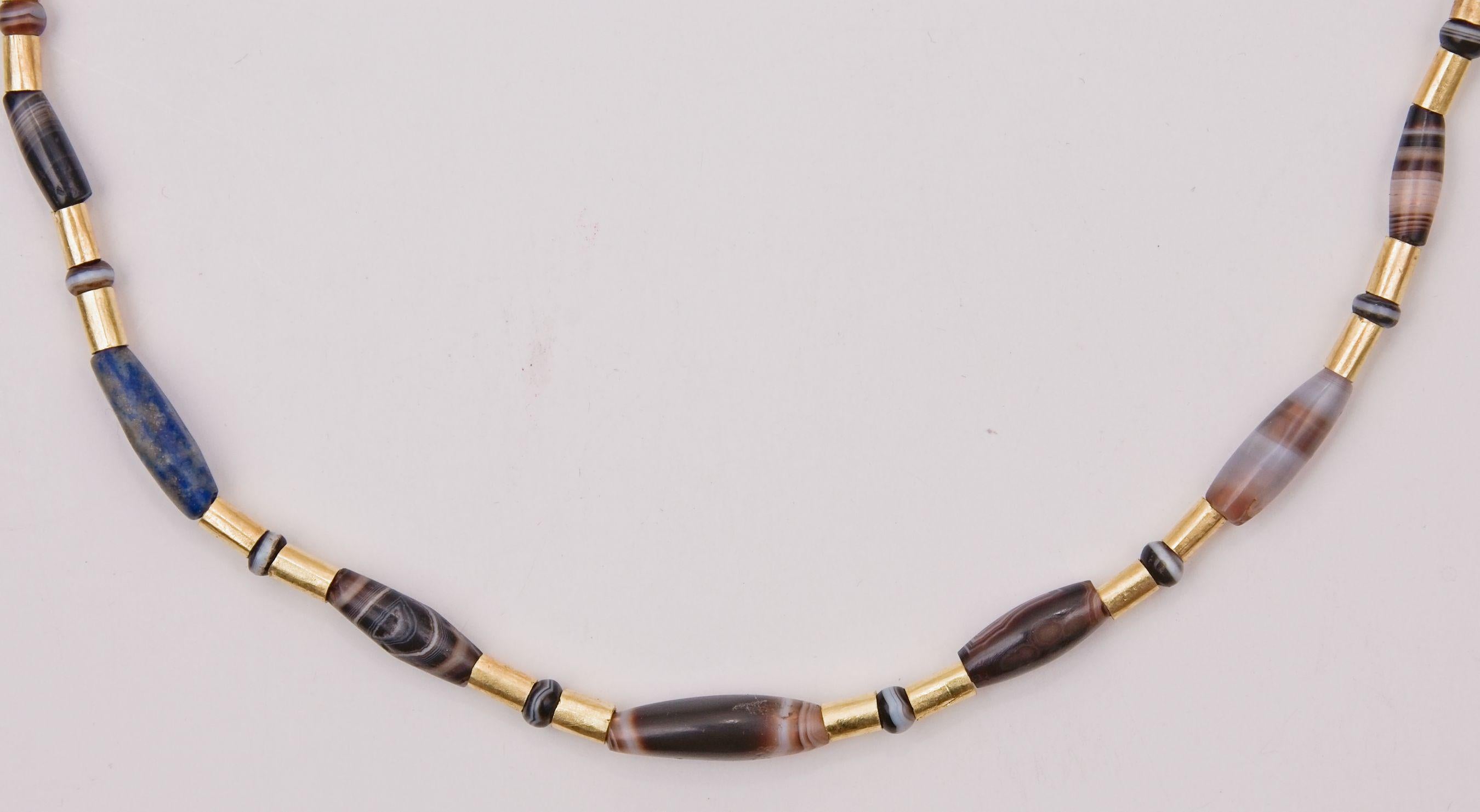 The idea of alternating gold beads with an equal number of round and barrel-shaped beads made of a variety of colored stones comes from our appreciation of the jewelry of Susa in the Achaemenid Period (4th century B.C.). Susa (biblical Shushan) lay