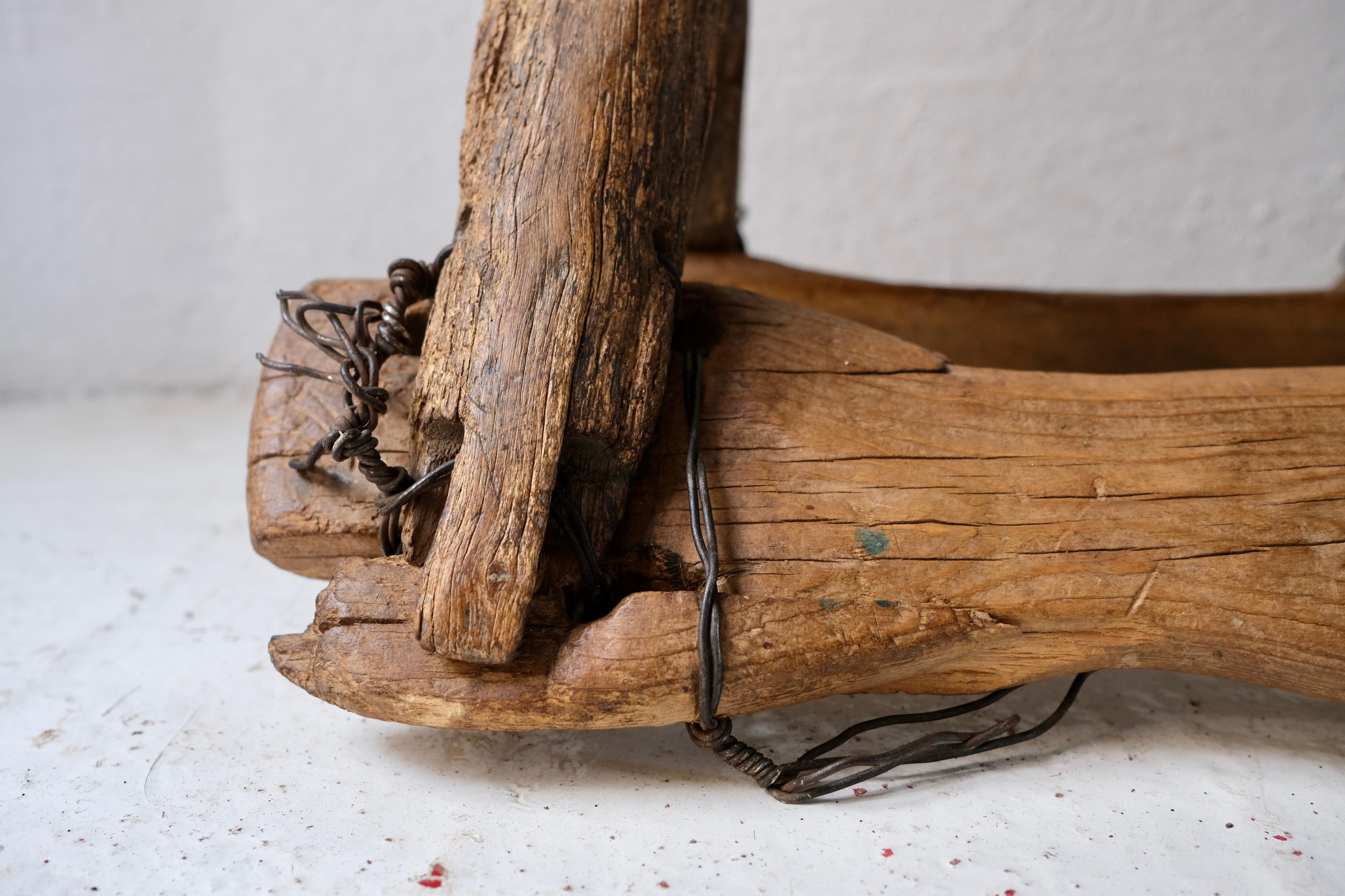 Mesquite, hand carved donkey saddle from Guanajuato, Mexico, circa 1920's. Original wire wrapping.