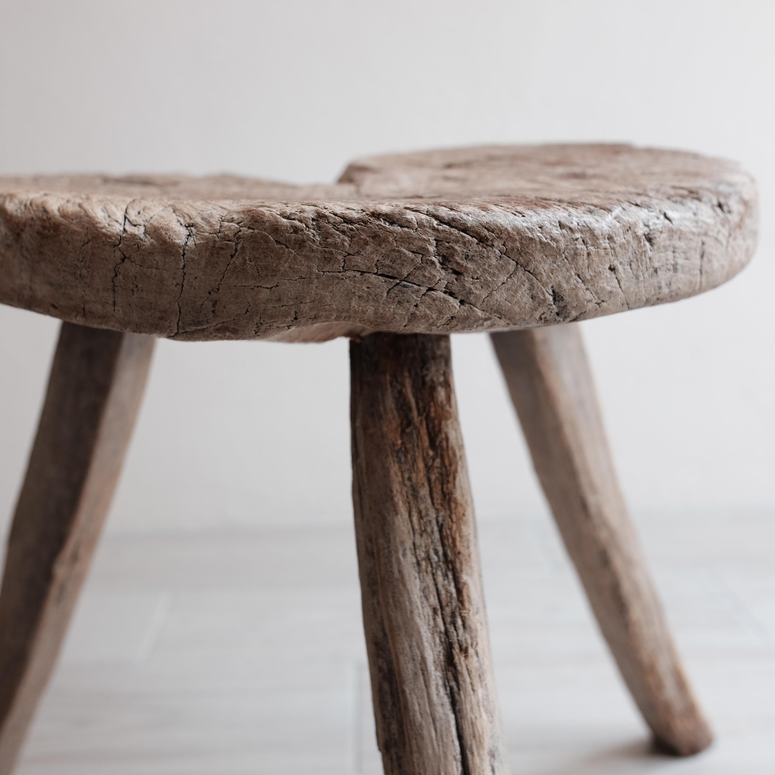 Hand carved mesquite stool from Guanajuato, Mexico. Incredible patina from age and wear. Primitive in style. Structurally sound despite partial fracture. Obtained from a private collection in San Miguel de Allende.