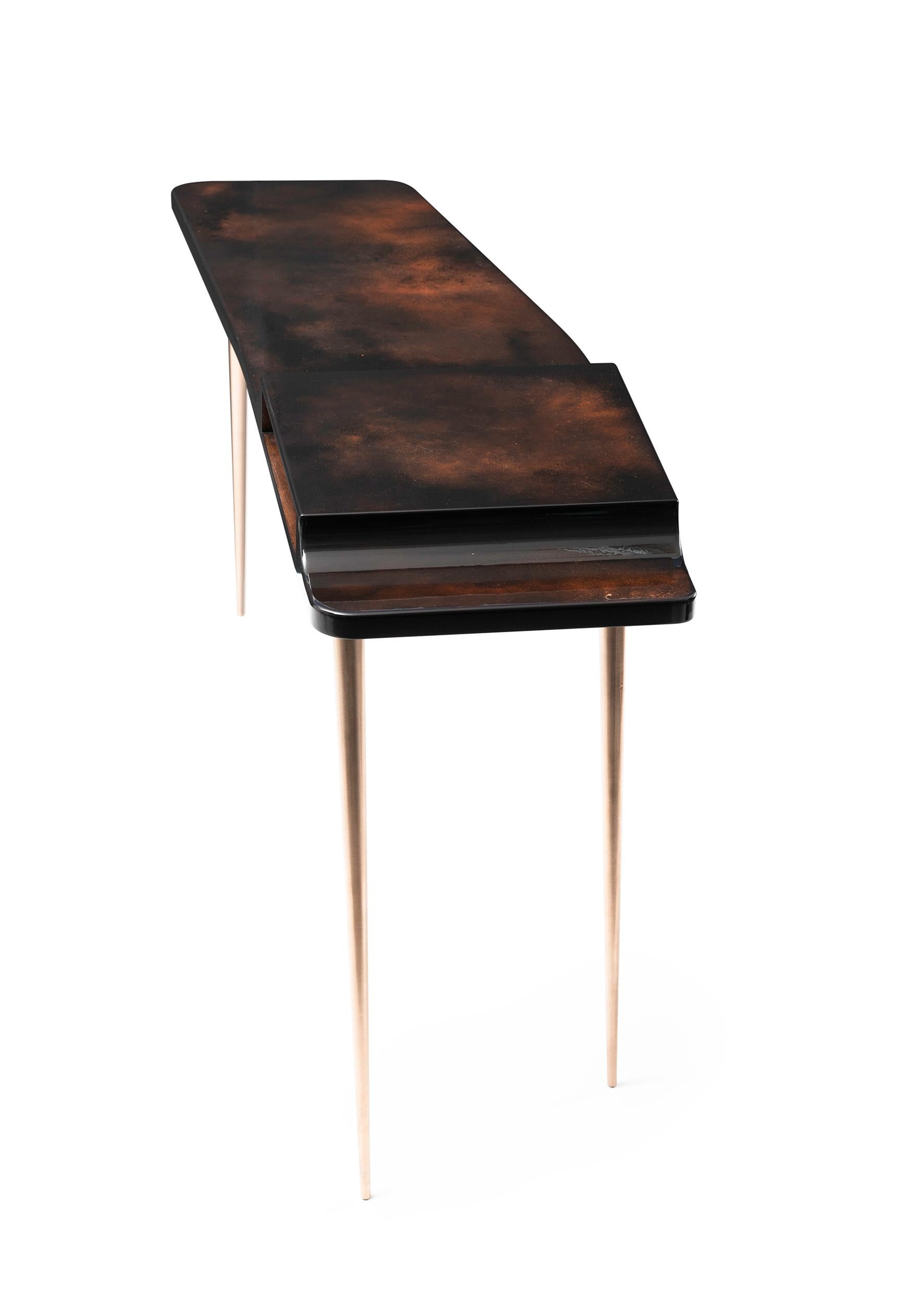 Messier 77 Console – 21st century modern luxury gold and copper desk console

Rich contemporary elegance embraced in the depth of materials of this freestanding console table is making much to carve its graceful Silhouette.

Opulent alliance of