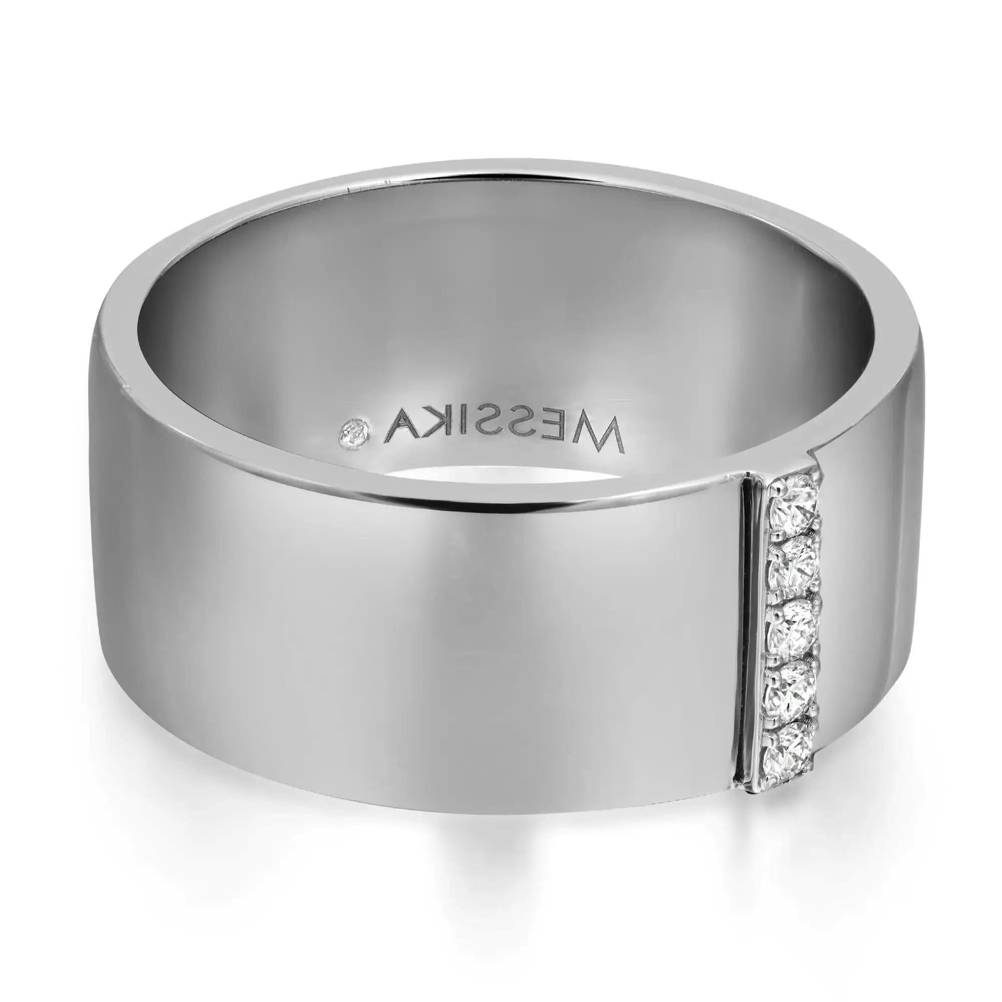 Modern and chic Messika Kate diamond wide band ring crafted in 18K white gold. This ring is accented with a single row of 5 pave set round brilliant cut diamonds in the center. Total diamond weight: 0.07 carats. Diamond quality: color G and clarity