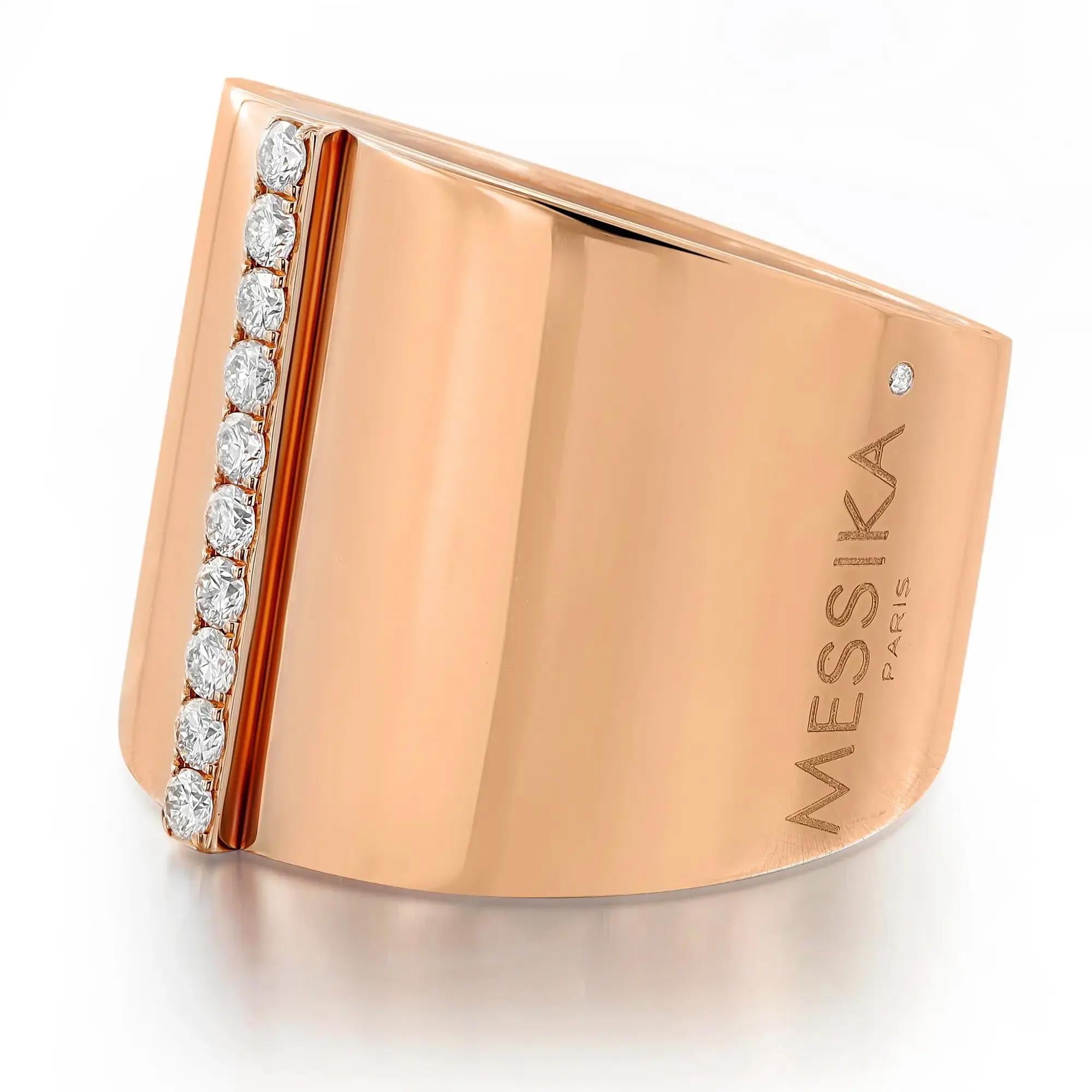 Modern and chic Messika Kate diamond wide band ring crafted in 18K rose gold. This ring is accented with a single row of 10 pave set round brilliant cut diamonds in the center. Total diamond weight: 0.17 carats. Diamond quality: color G and clarity