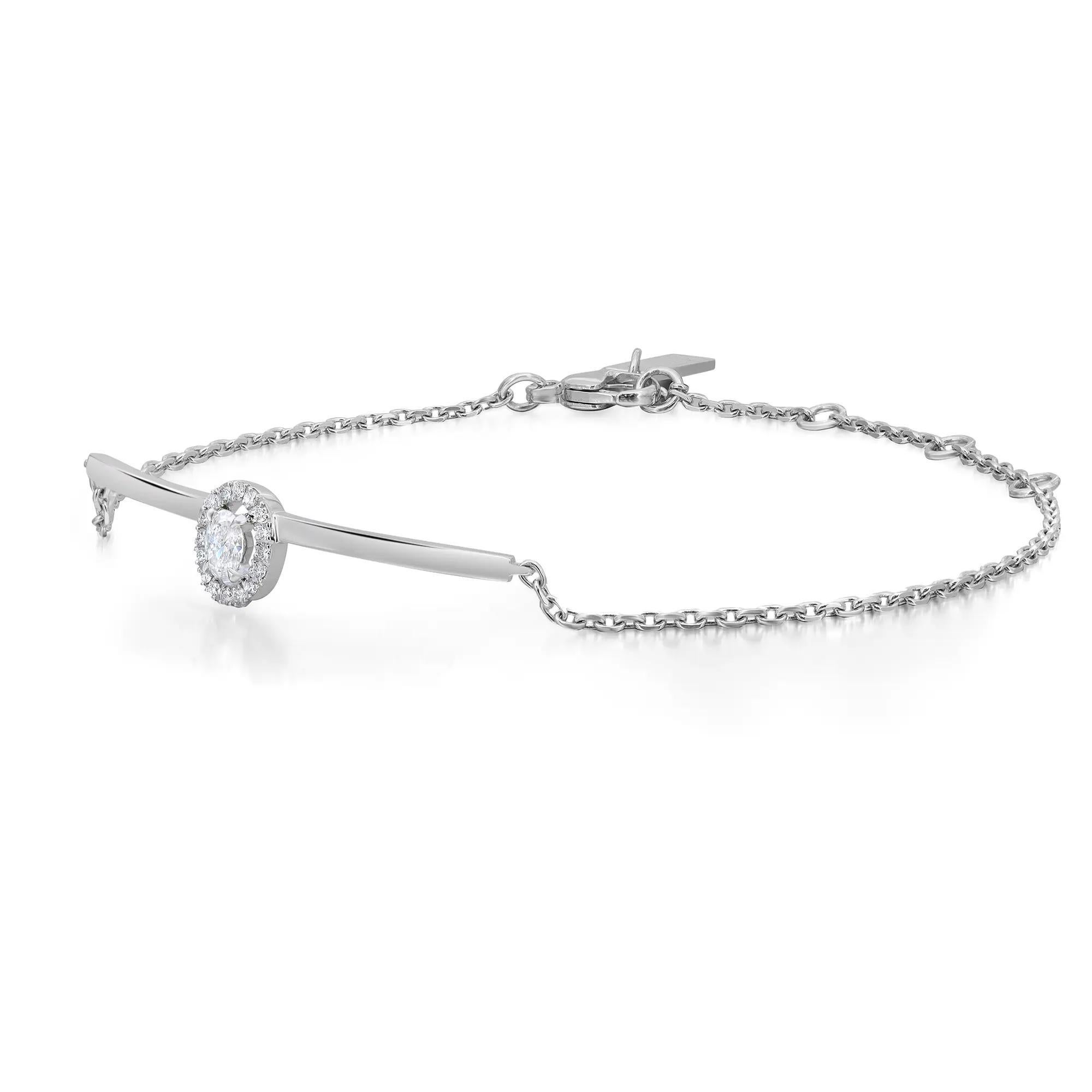 Eleg, cet élégant bracelet à chaîne en diamants Messika Glam'Azone est parfait pour un look de tous les jours. Whiting en or blanc 18 carats hautement poli. Elle est ornée d'un diamant ovale étincelant serti sur la pointe et d'un halo de diamants