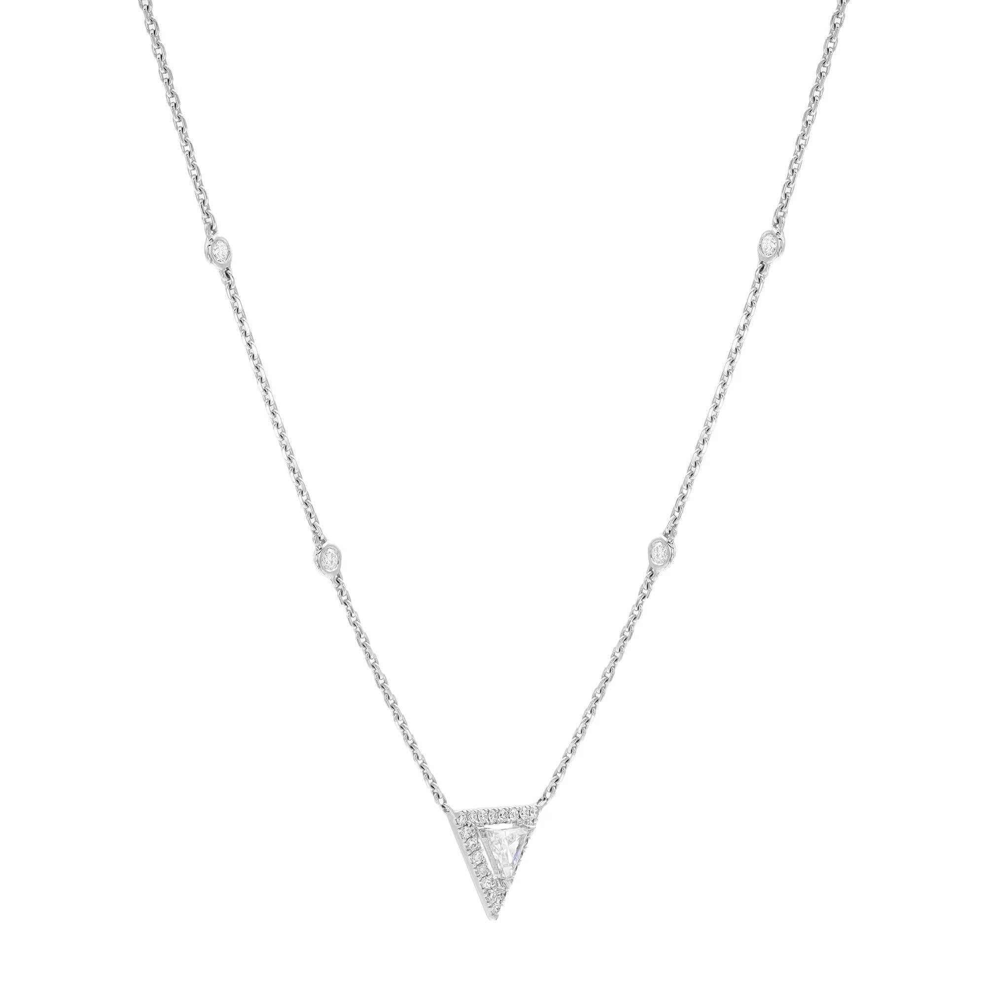 This stunning Messika Thea diamond pendant necklace adds sheer beauty and brilliance with a striking prong set triangular cut diamond in the center with a round cut diamond halo along with the diamond by the yard chain that further completes the