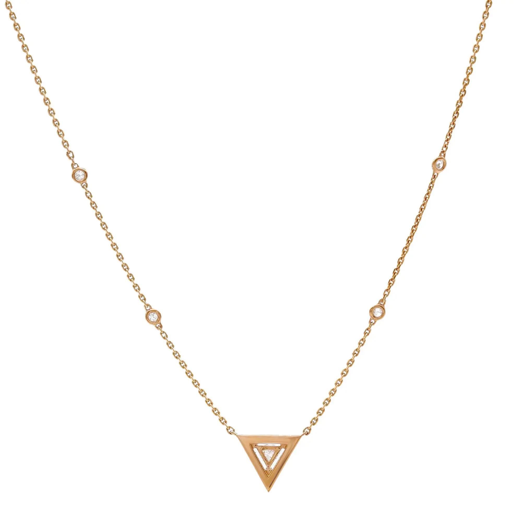 This stunning Messika Thea diamond pendant necklace adds sheer beauty and brilliance with a striking prong set triangular cut diamond in the center with a round cut diamond halo along with the diamond by the yard chain that further completes the