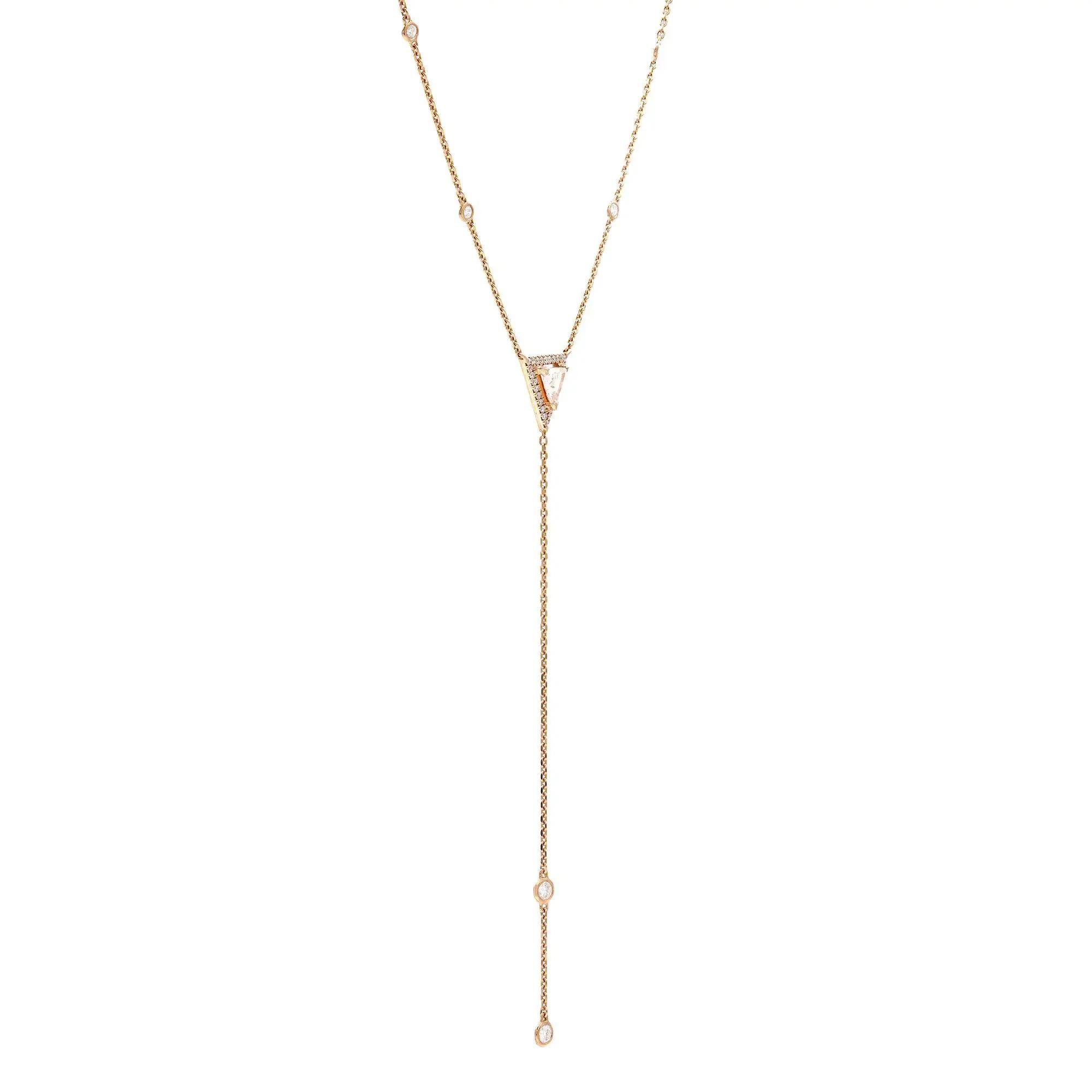 So dainty and pretty, perfect for any occasion. This beautiful Messika Cravate Thea diamond lariat chain necklace is crafted in 18K rose gold. It features a center prong set triangular diamond with a halo of round cut diamonds along with a diamond