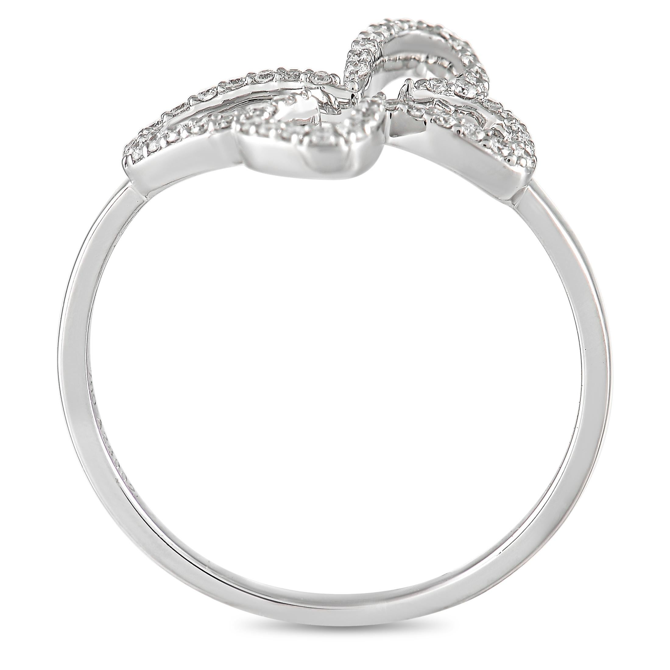 This cute butterfly ring from Messika is made with 18K white gold, forming the outline of a butterfly on the face of the ring. The butterfly is set with 0.18 carats of round diamonds outlining its wings. The ring has a band thickness of 2 mm, a top