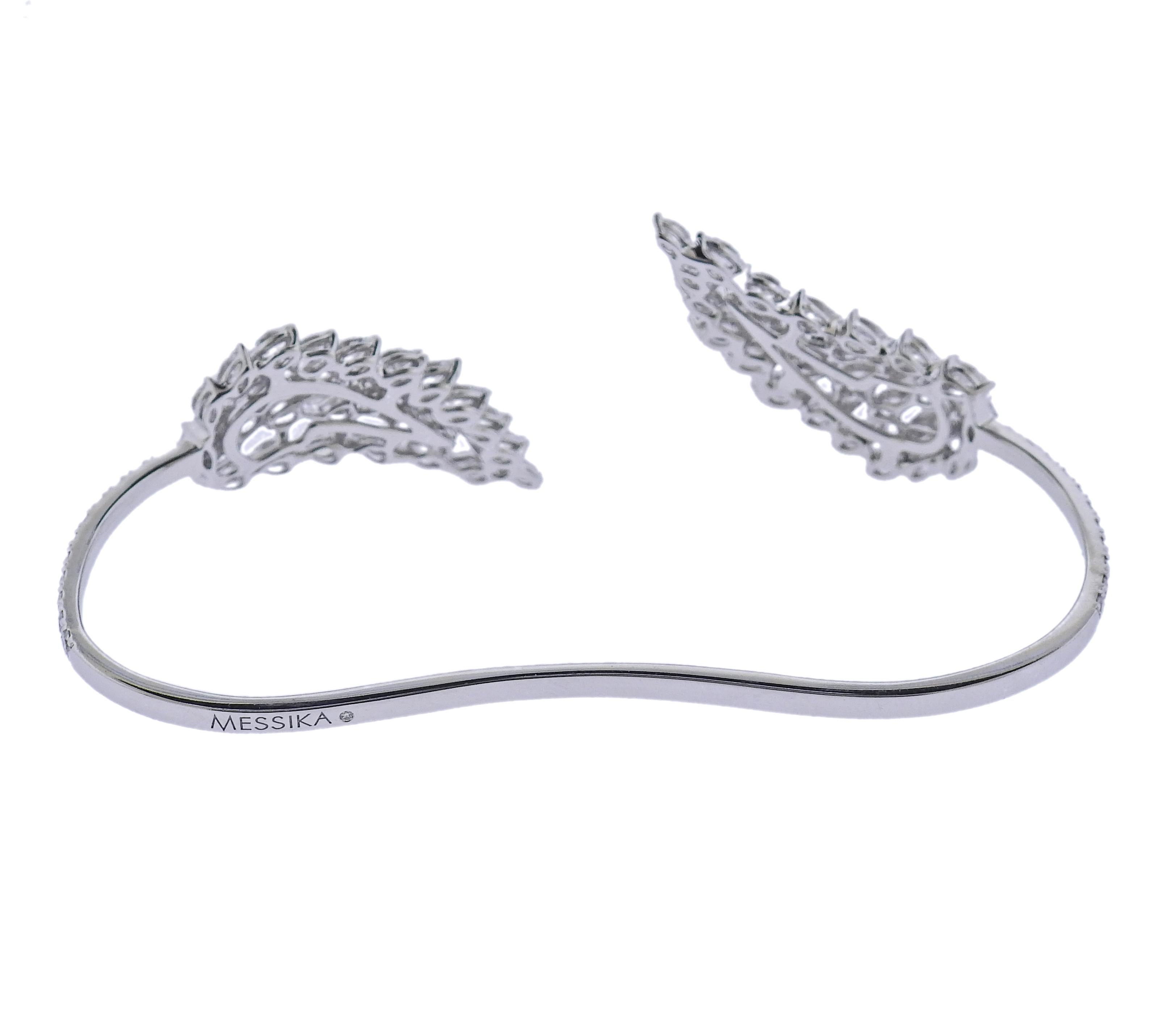 18k white gold Angel bracelet by Messika, set with 4.70ctw G/VS diamonds. Retail $33000. New, store sample, comes with box.  Bracelet will fit approx. 6.5