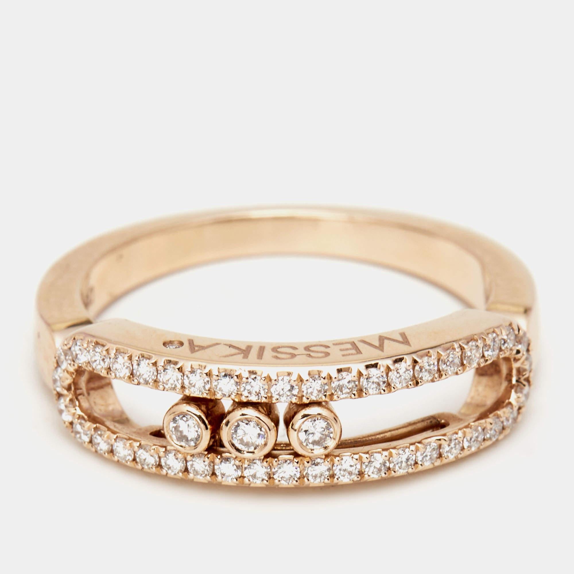 This Messika Baby Move diamond ring is a fine example of the label's prowess in jewelry making. It is sculpted using 18k rose gold and beautified with a signature cage and diamonds. The jewel is a sparkling reminder of special things, and the