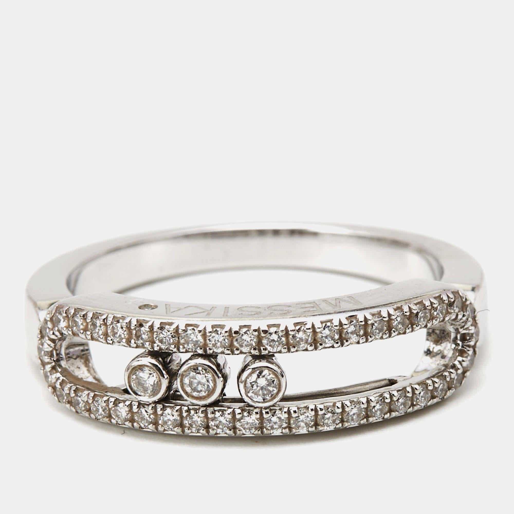 This Messika Baby Move diamond ring is a fine example of the label's prowess in jewelry making. It is sculpted using 18k white gold and beautified with a signature cage and diamonds. The jewel is a sparkling reminder of special things, and the