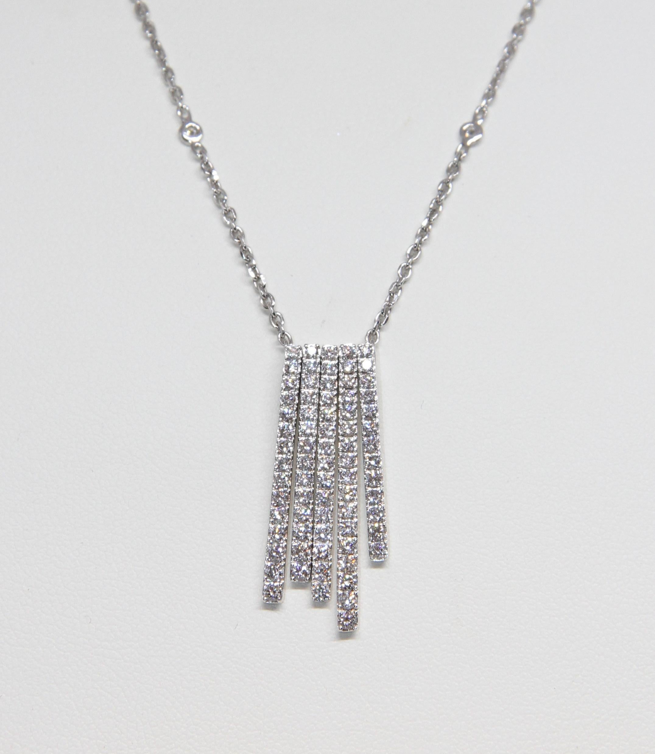 This pre-owned hand-made refine Messika Daria necklace (PM) is made of 18K white gold and diamonds.
The pendant features 5 bar shapes and each element is paved with brilliant cut diamonds. 
The chain is made of 18K white gold and is set with 4