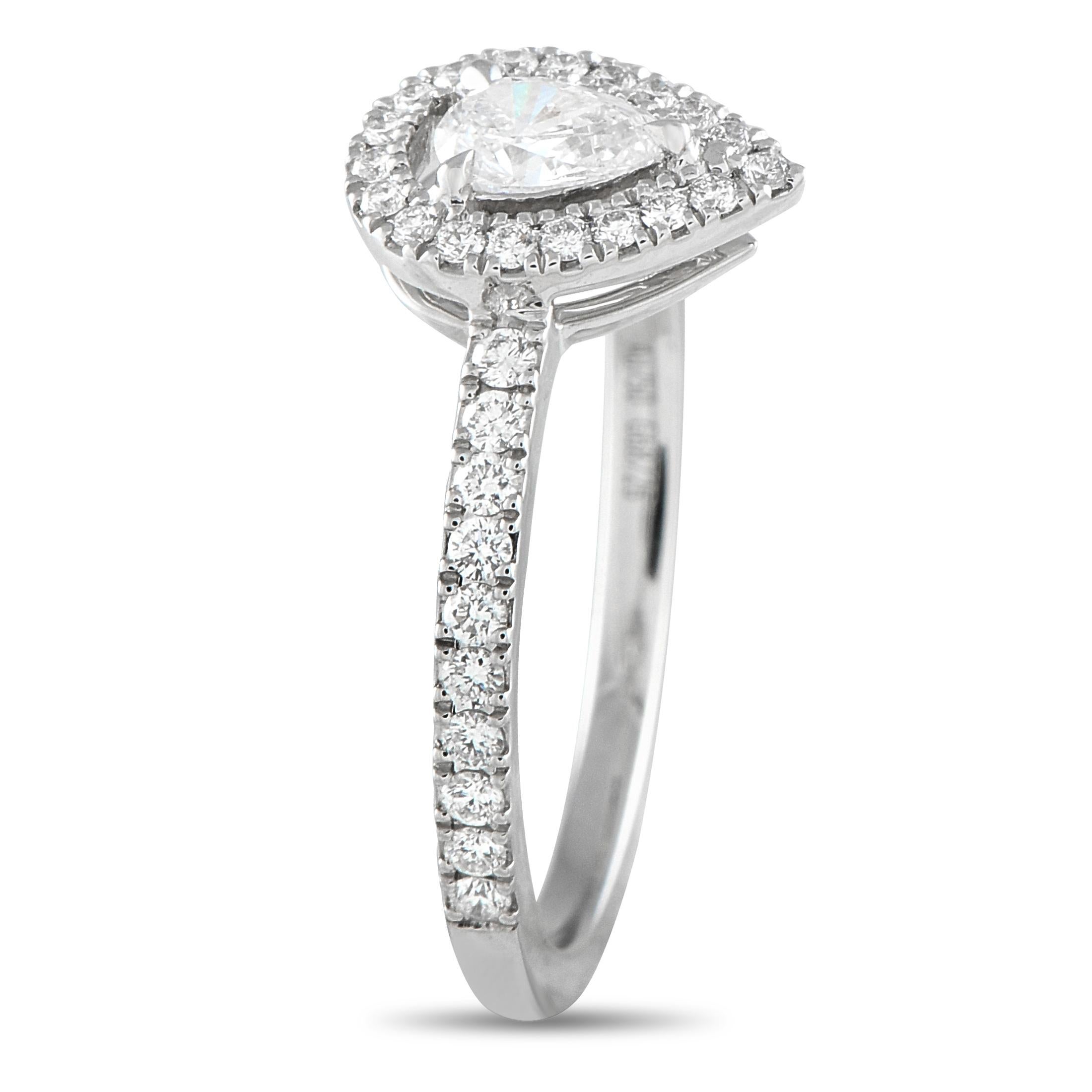 This Messika Joy ring offers a beautiful way to celebrate your love. Timeless and elegant, it features a pear-shaped Diamond center stone and additional Diamond accents that together possess a total weight of 0.50 carats. Made with an 18K White Gold