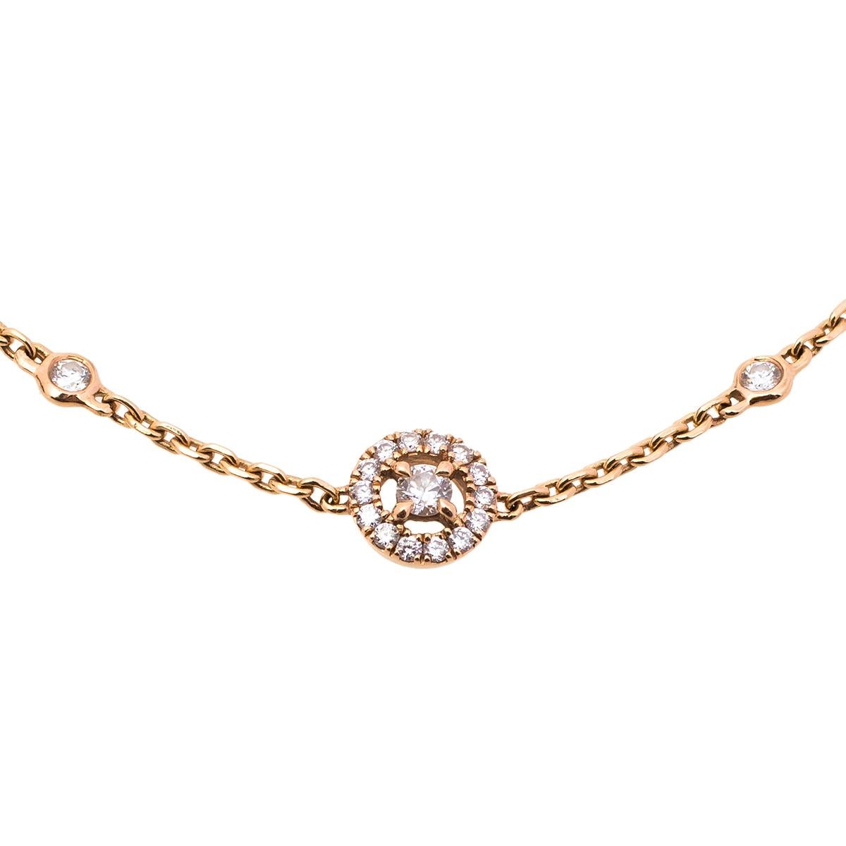 Precious diamonds that last forever. Messika's Joy bracelet is a priceless jewel that is glamourous, light, and wearable. Made from 18k rose gold, the bracelet has a central motif of a diamond guarded by a halo of more diamonds. This beautiful