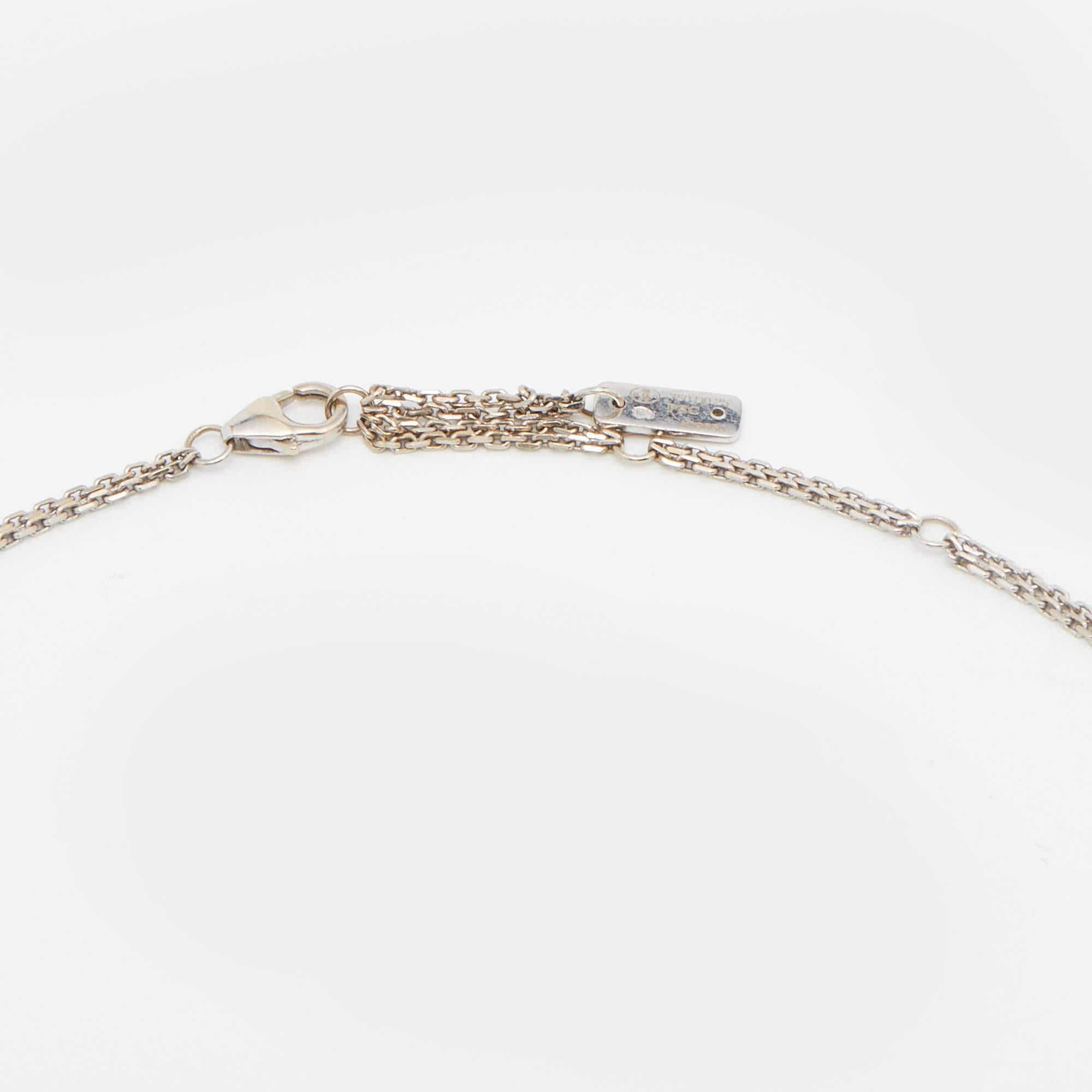 The Move collection has designs that are both wearable and timeless. This wondrous thing of beauty is handmade from 18k white gold, and the double chains hold a feminine, rectangular cage pendant. Within the cage, three diamonds are trapped, and
