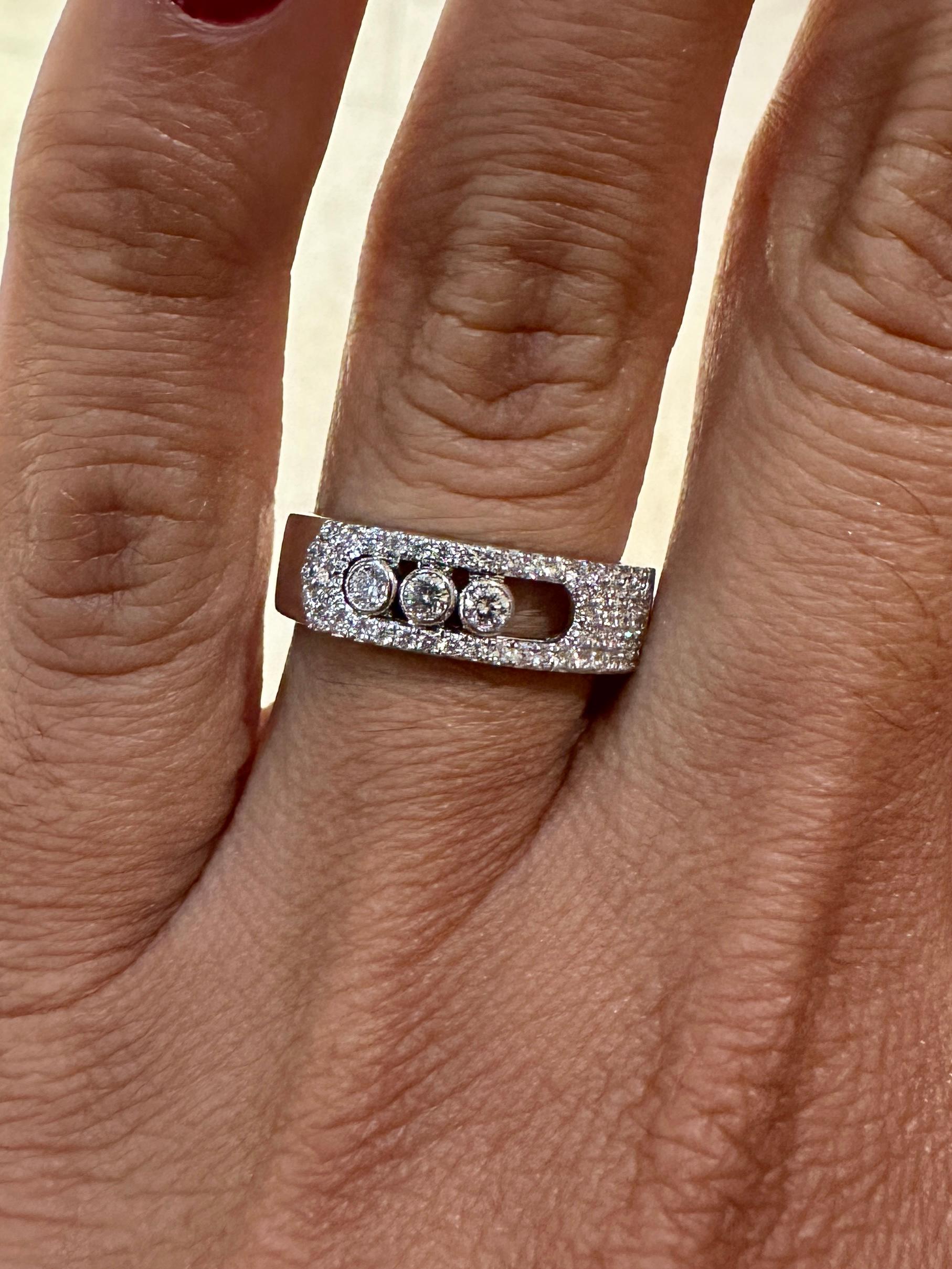 Messika Move Noa pavé ring in 18k white gold is set with three brilliant cut diamonds in motion. This white gold diamond band ring is like a golden ribbon that wraps around the finger. This ring is perfect to mark a precious moment or an engagement.