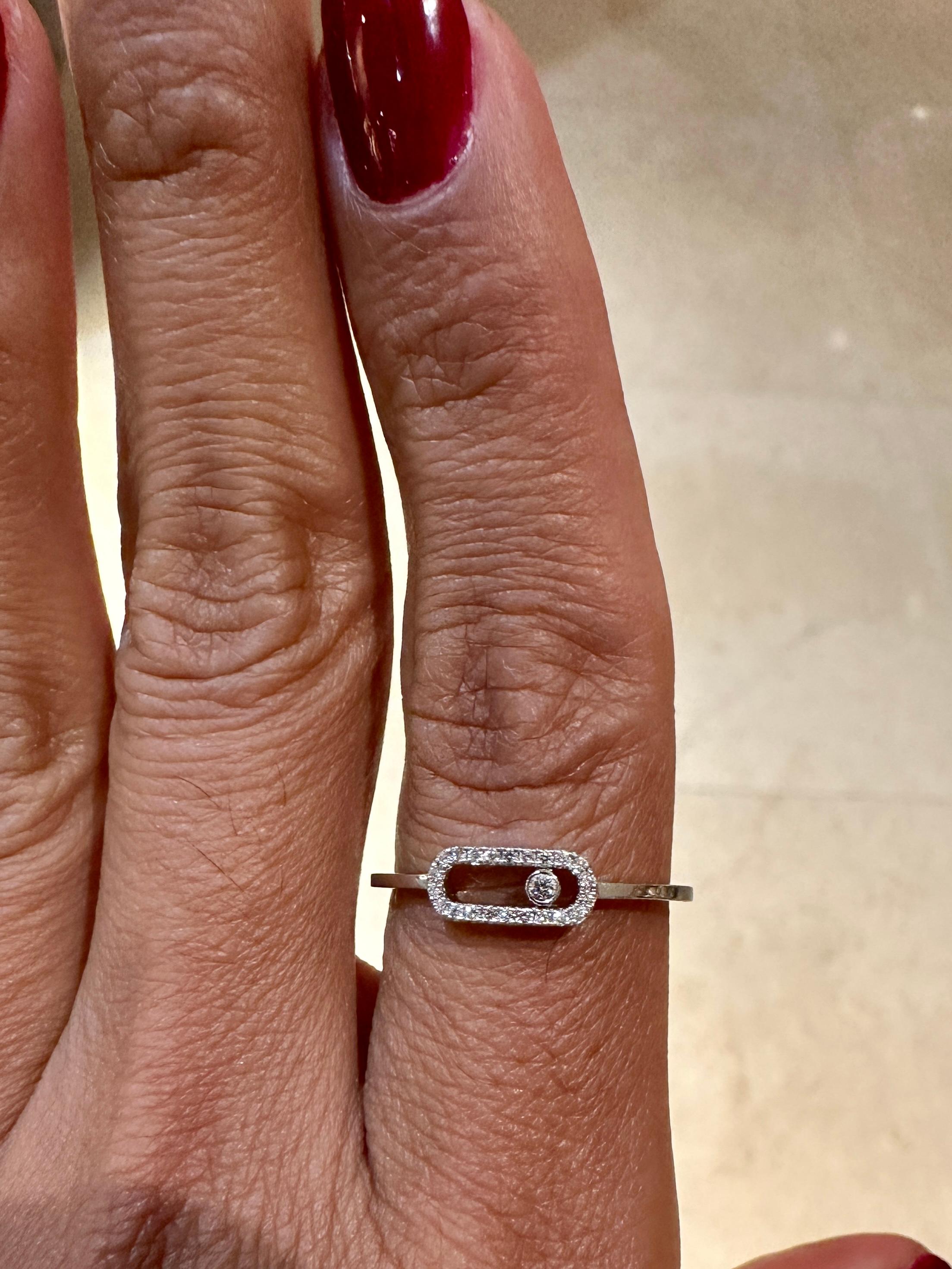 This beautiful 18 carat while gold pavé diamond band ring, fully handcrafted and set with one brilliant cut diamond, is part of Move jewellery collection, the signature of Messika House.

Diamond weight: 0,09 carat, quality G/VS
Length of the