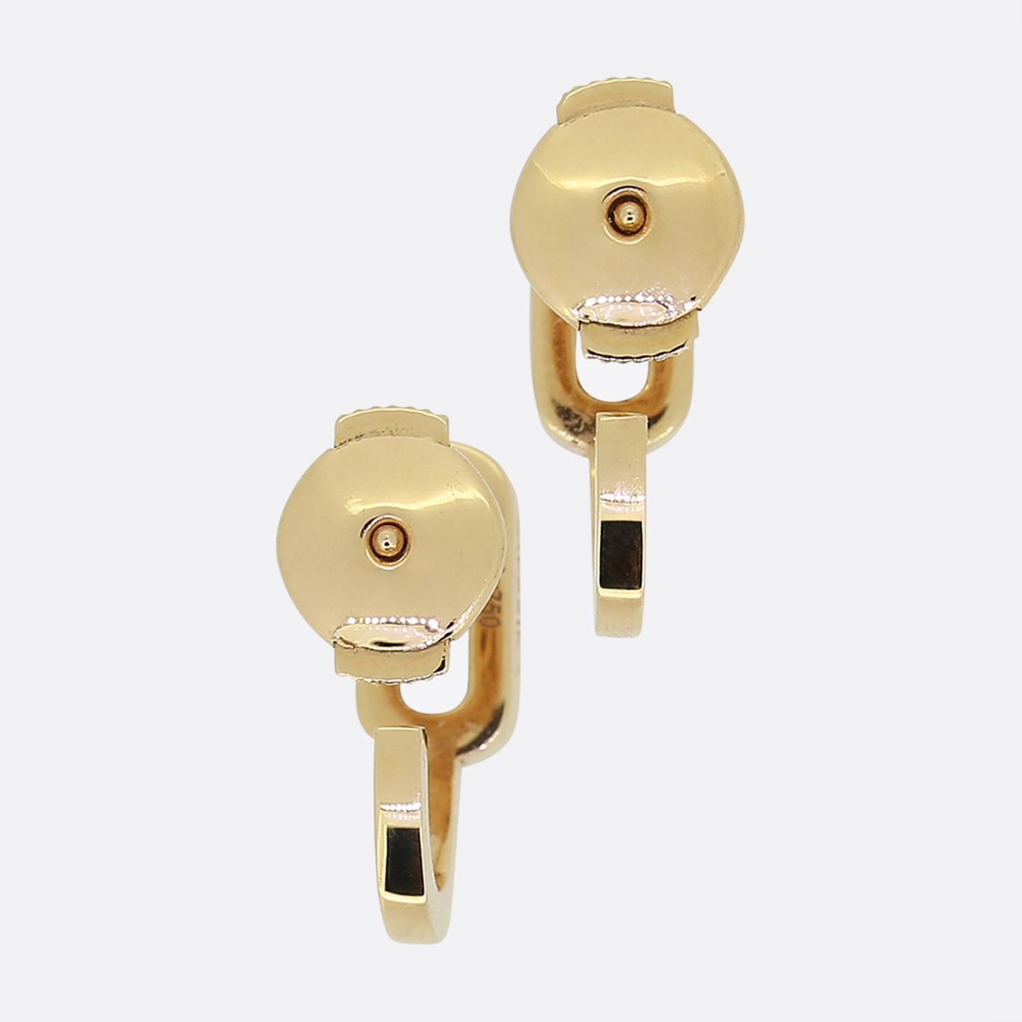 Here we have a contemporary, stylish pair of diamond earrings from Messika. Each piece has been crafted from 18ct rose gold with a half hoop below an open oval frame above which, in turn, plays host to a single round brilliant cut diamond. 

These