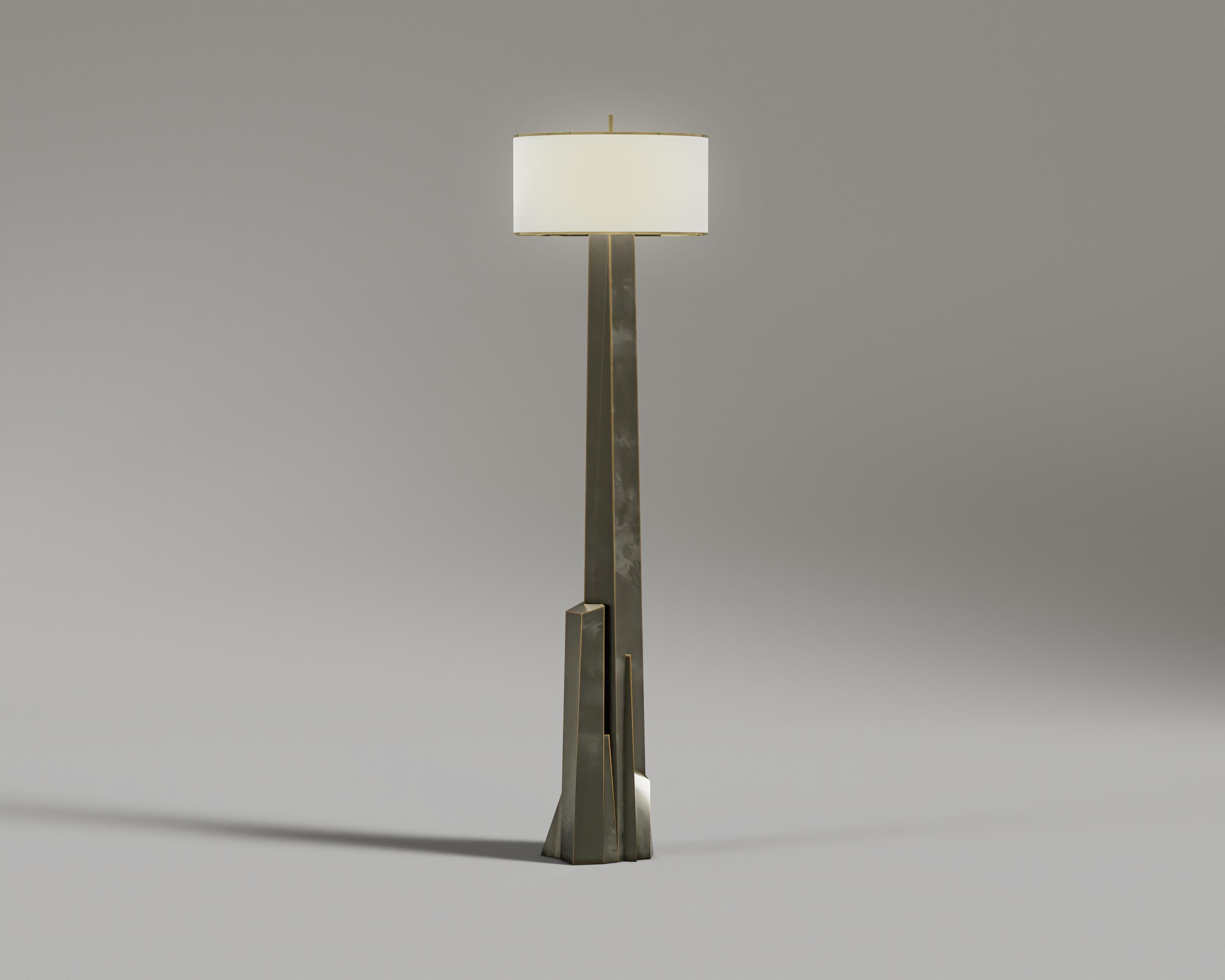 Meta Floor Lamp: 
A unique masterpiece with architectural pieces and bronze frames, brings luxuries to every environment with an elegant luminary. Create an atmosphere of sophisticated warmth in any space with the Meta floor lamp.

Materials and