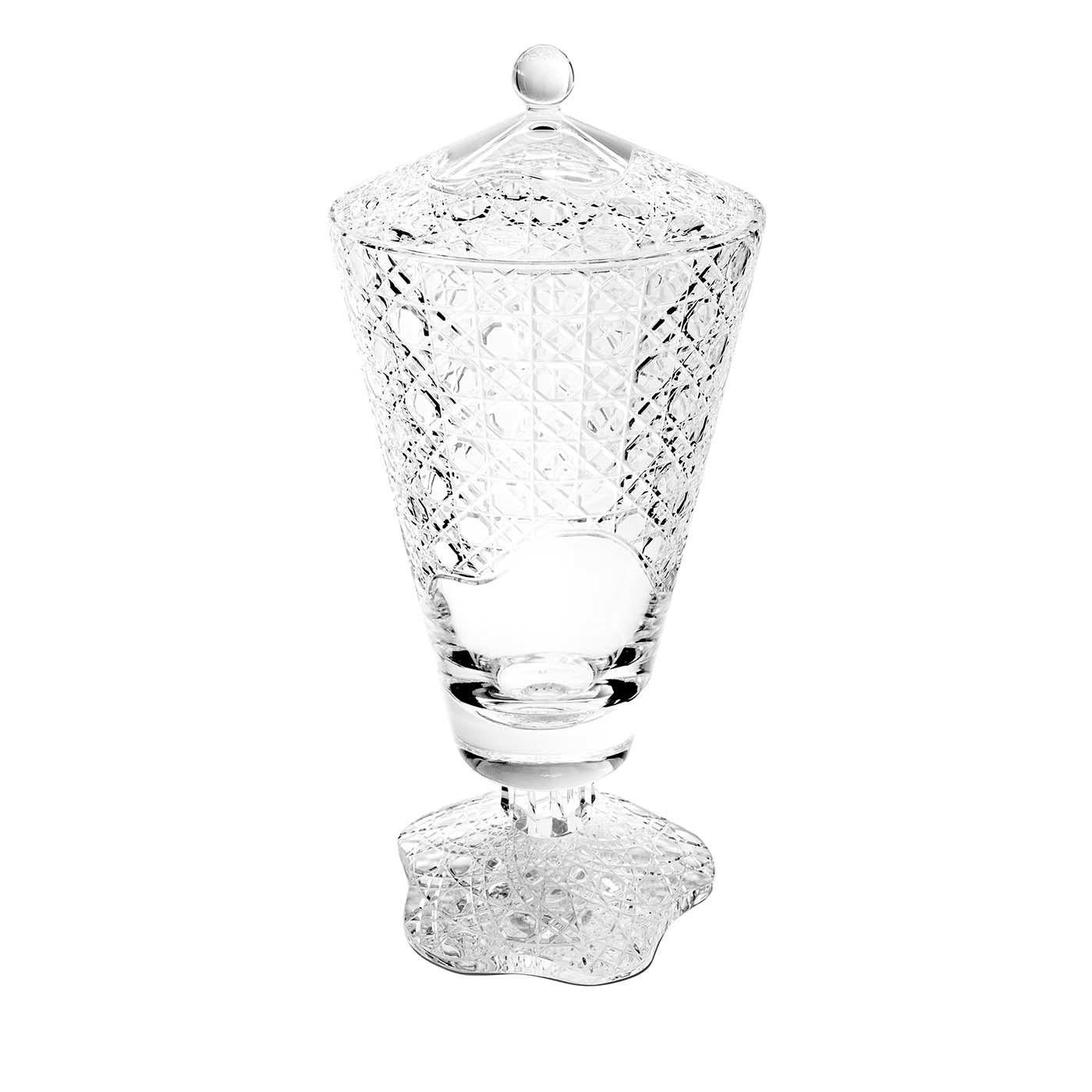 This stunning vase with lid is part of the MetÃ Morphosis collection. Crafted of transparent glass, this piece can be used as an elegant container in a kitchen, living room, or dining room, while also imbuing any home with the sophisticated allure