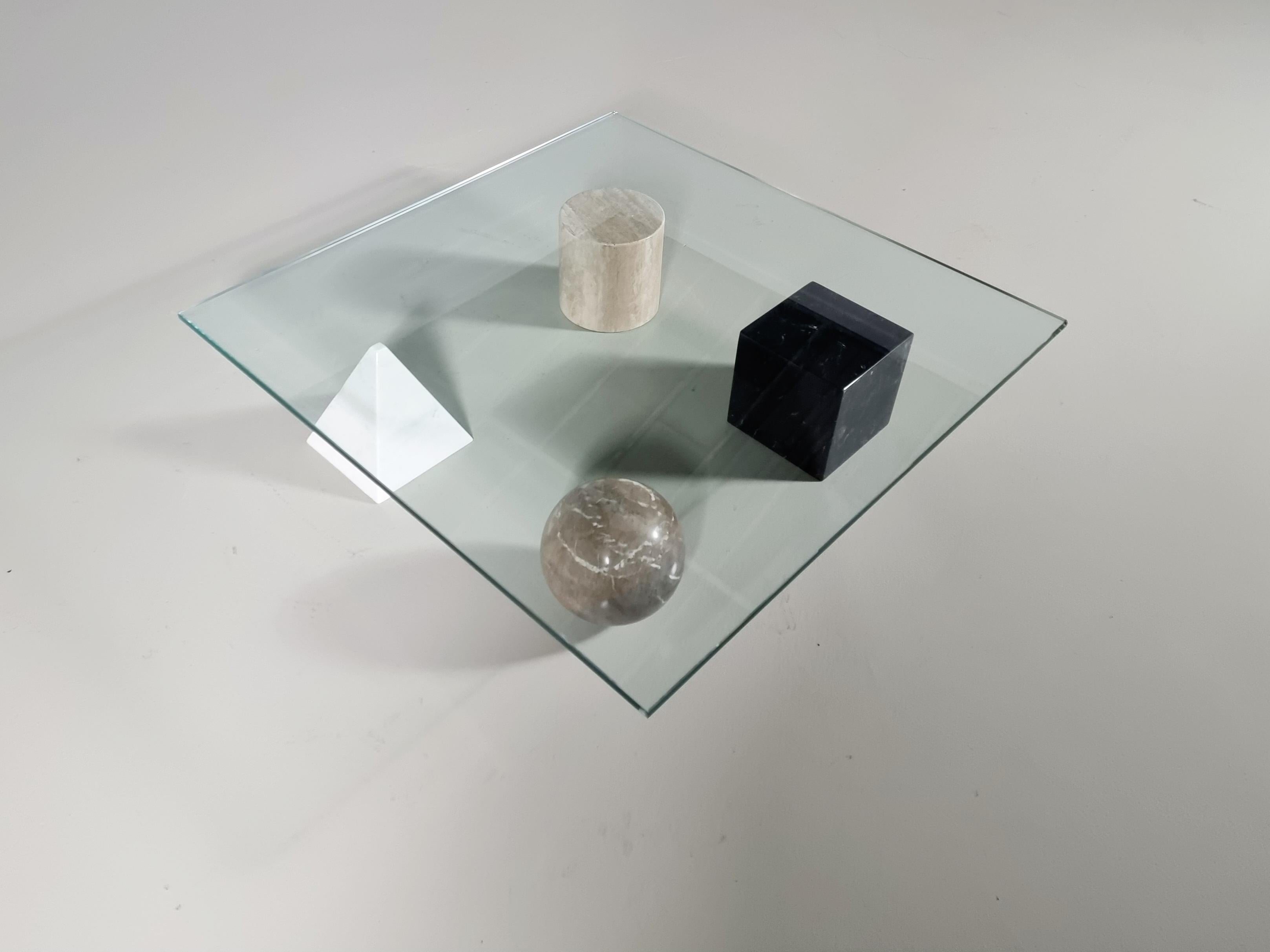 Sculptural Metafora coffee table designed by Lella and Massimo Vignelli. in the 1970s. Inspired by the four forms of Euclidean geometry, the cube, the pyramid, the cylinder, and the sphere, the four elements can be positioned freely for a unique