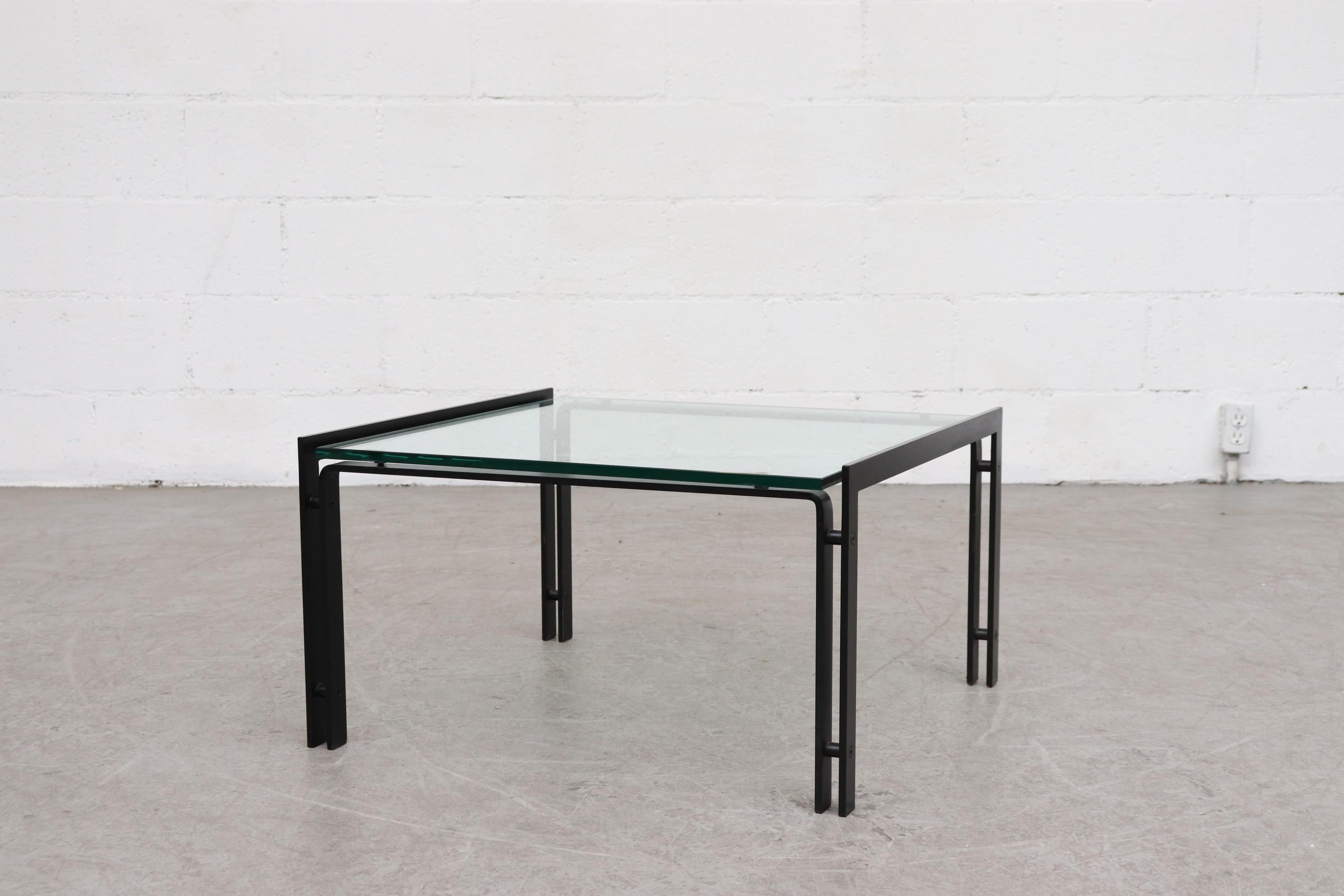 Metaform glass coffee table with black enameled metal frame. Double banded metal frame, new 1/2