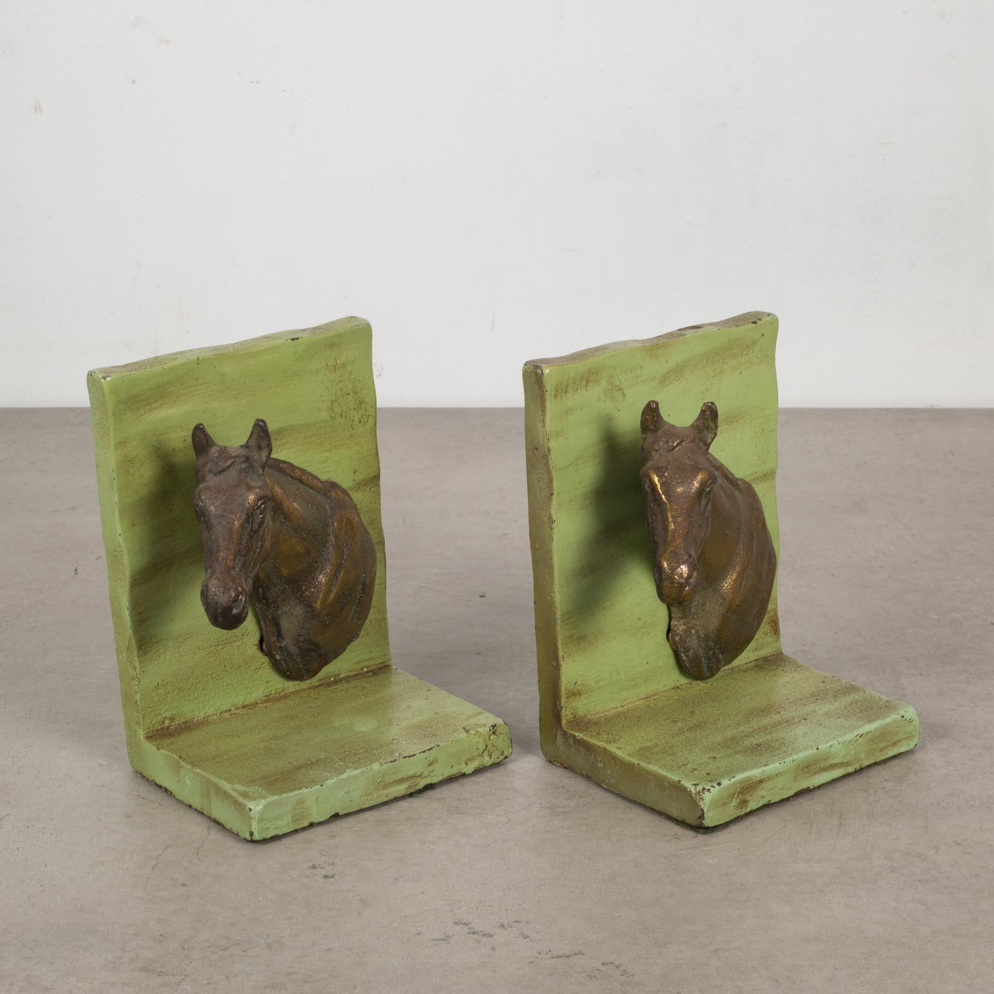 About:

This is an original pair of metal bookends with brass horses,

Creator: Unknown.
Date of manufacture: circa 1940-1950.
Materials and techniques: Metal, brass.
Condition: Good. Wear consistent with age and use.
Dimensions: H 5 in. x W