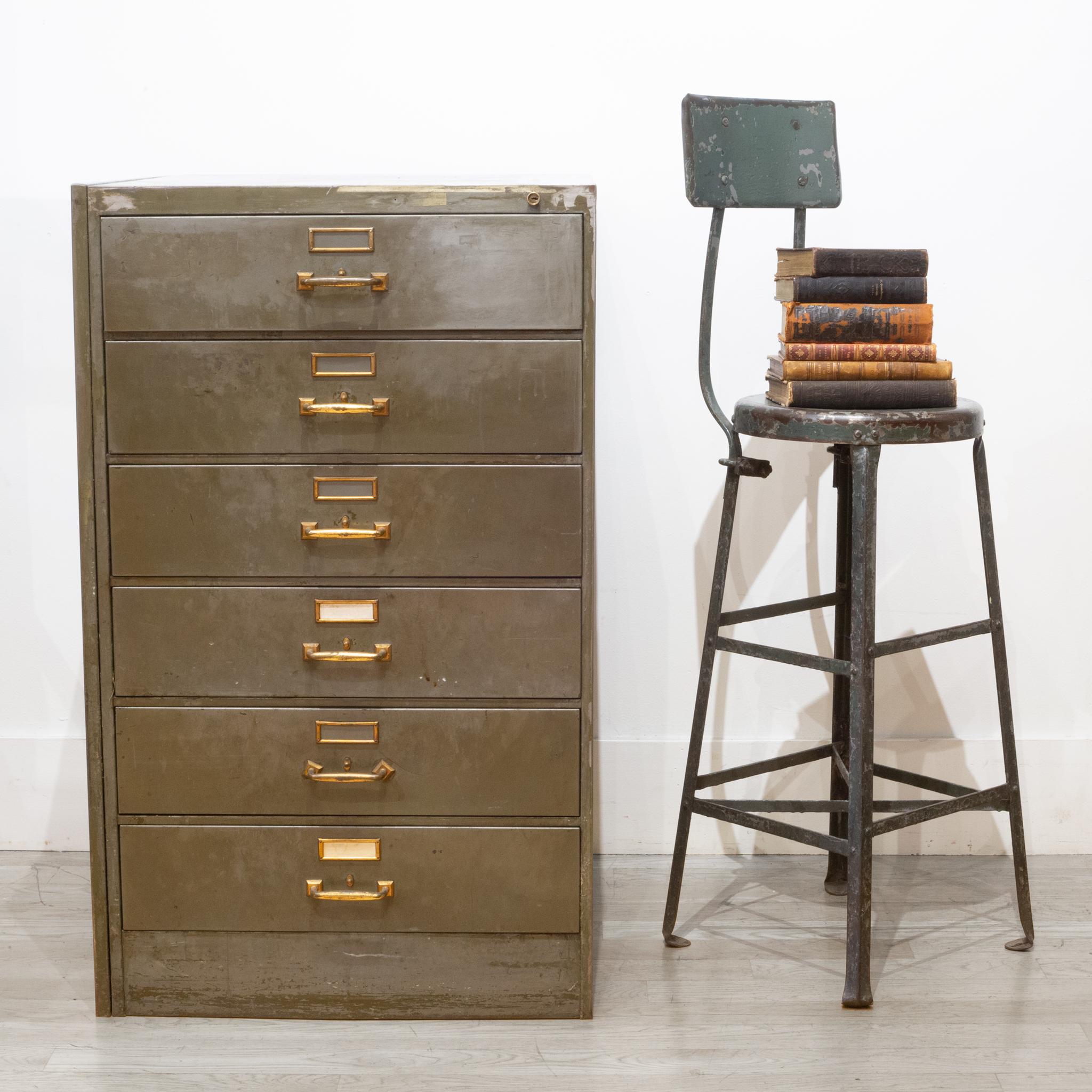 About

An original all metal six drawer file cabinet with brass handles and brass card holders. Each drawer has a unique release lever that unlocks the drawers. One cabinet has an original label. This piece is solidly built and each drawer opens
