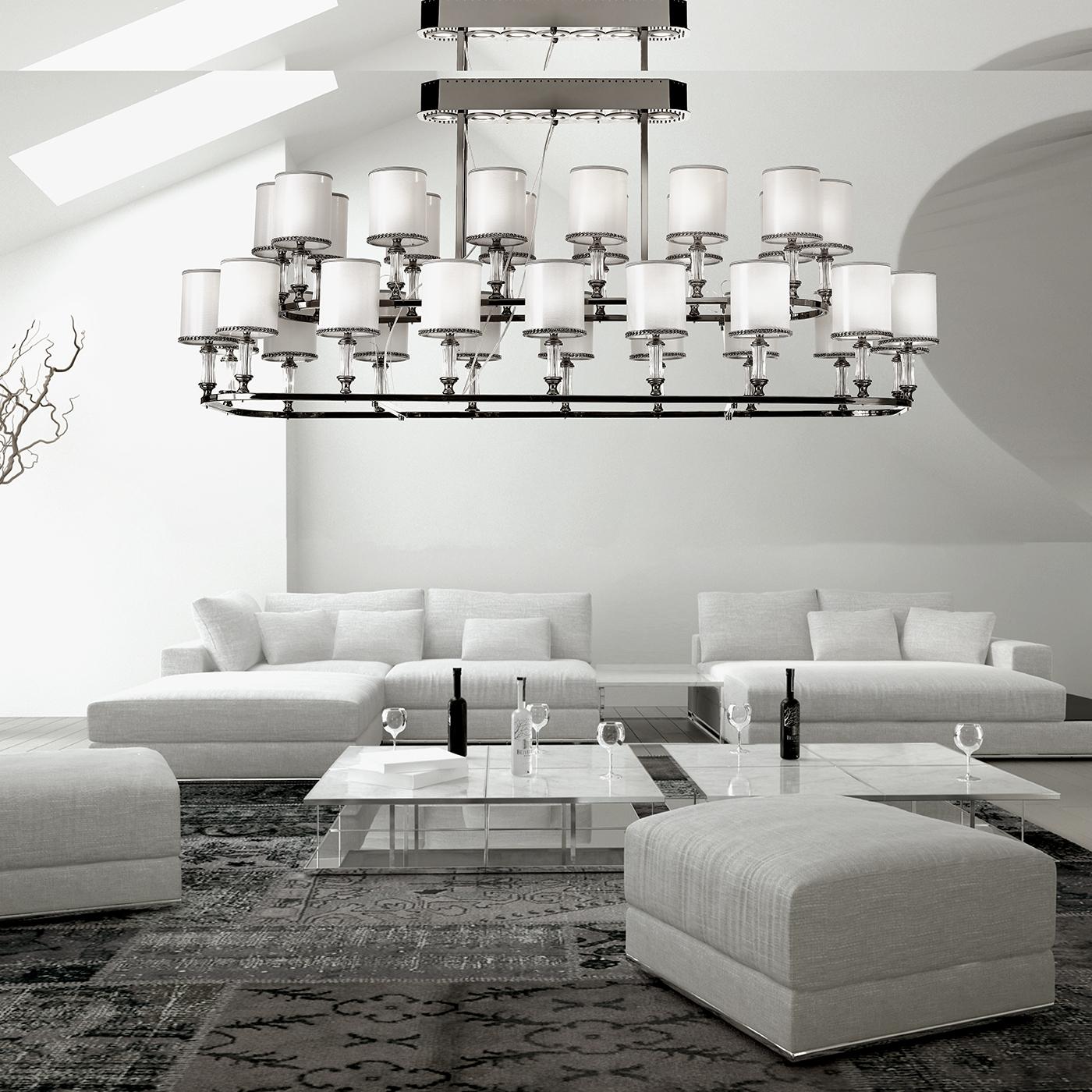 Thanks to its stately size and sophisticated silhouette, this magnificent chandelier will enrich a large entryway or highlight a dining table. The lightweight metal structure with beveled corners is handcrafted and has a black nickel finish that