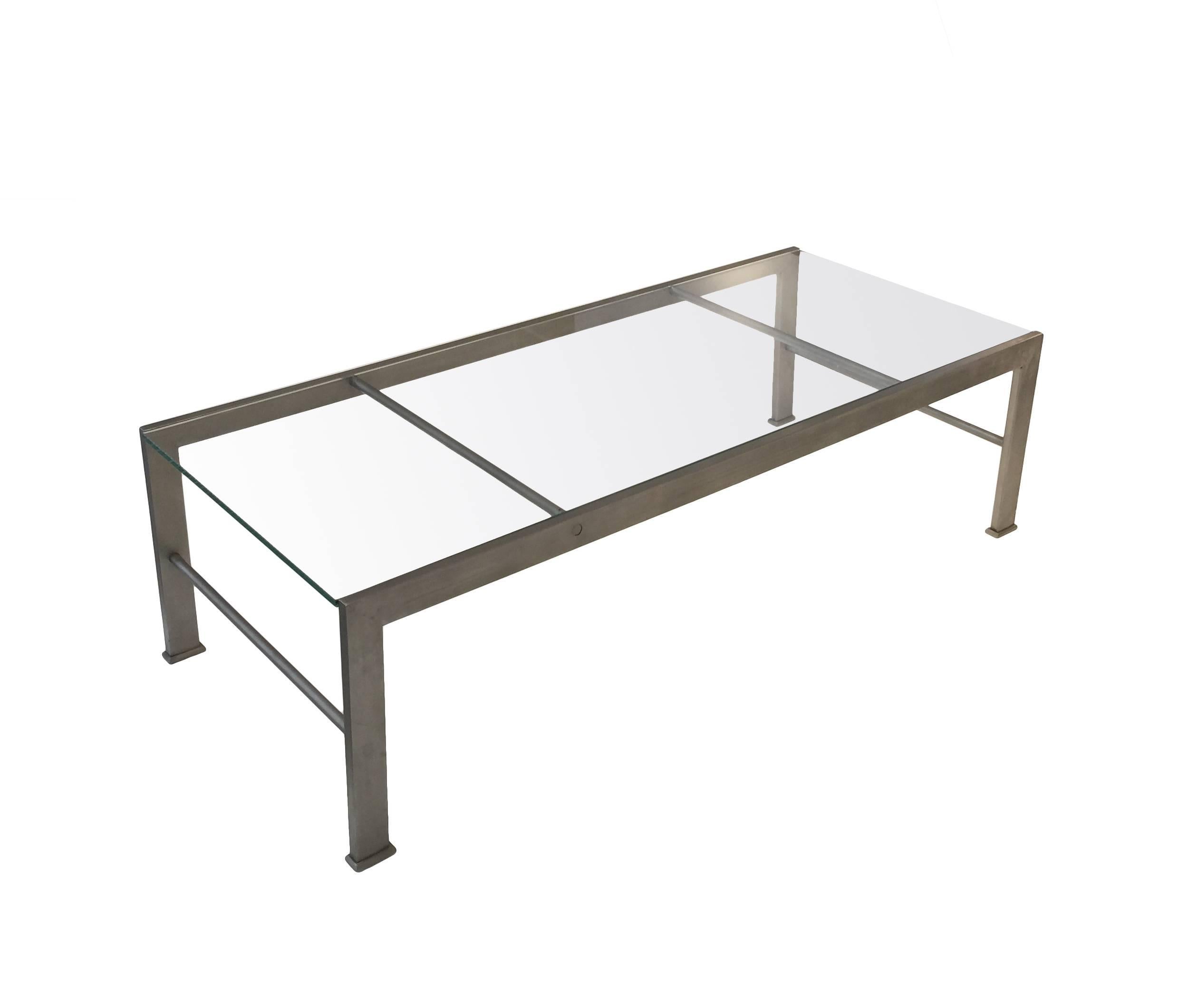 A metal and glass coffee table after a design by Marc du Plantier

Marc du Plantier (1901-1975) created the design for this table circa 1934 for the home of a M. Bignon, Paris. His original design was for a table of gilt iron and glass and he