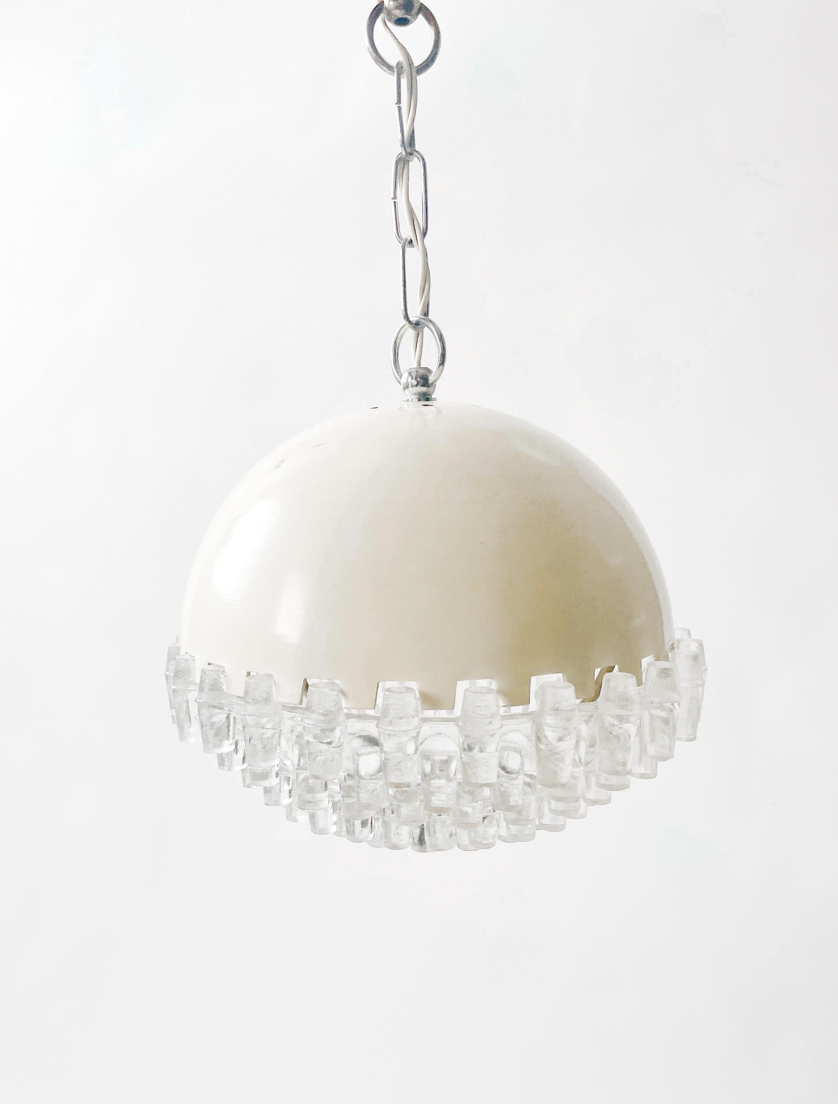 Unusually beautiful metal and glass pendant lamp produced in Yugoslavia by Sijaj Hrastnik ca 1960. Measures 9” in diameter and 8” in height not including the chain. Minor imperfections in the metal as shown.