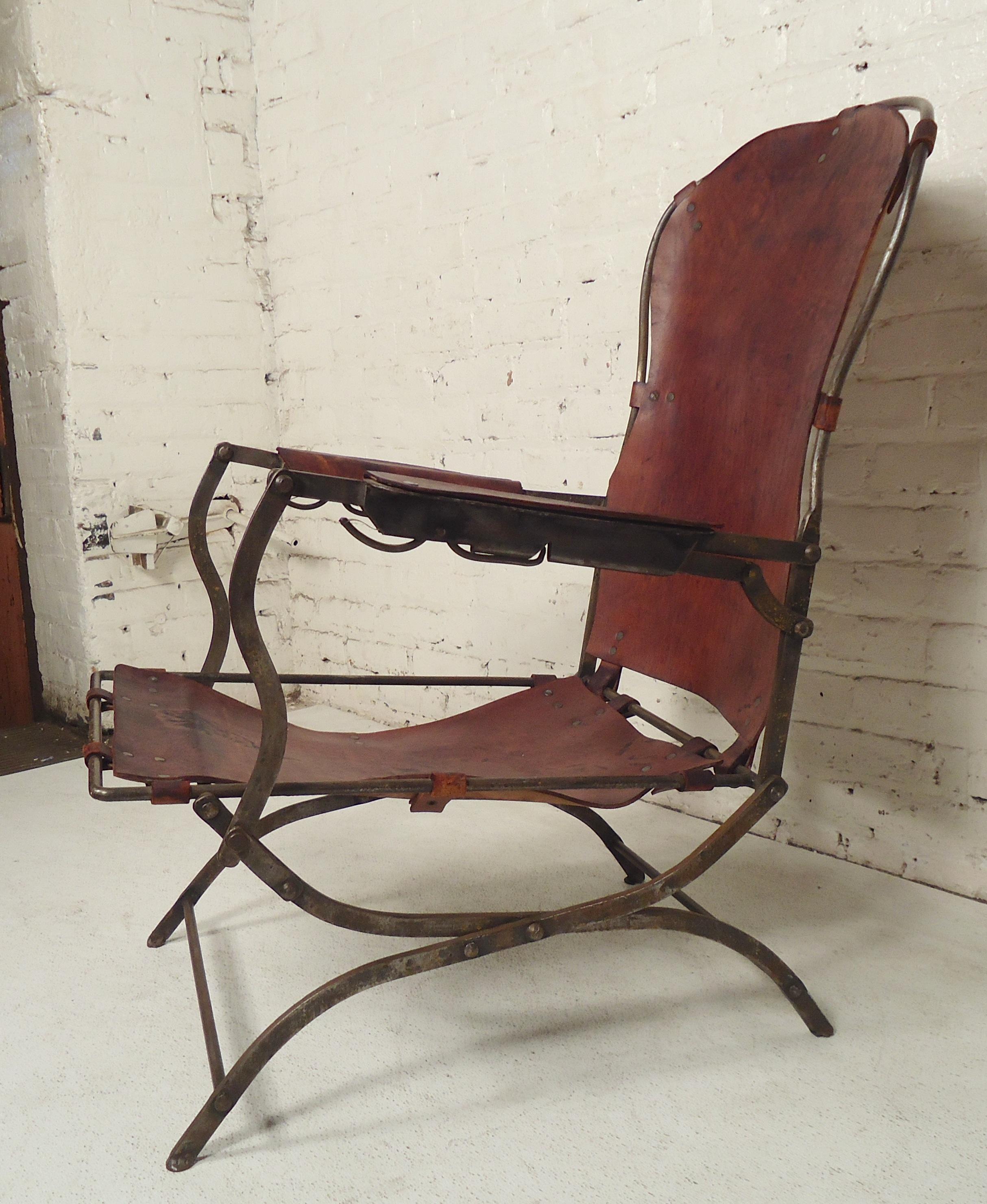 Very unusual armchair with industrial style metal frame and leather seating with beautiful patina.

(Please confirm item location - NY or NJ - with dealer).
 