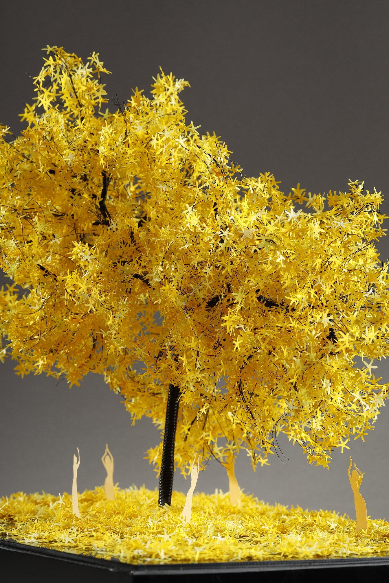 This unique piece by Lebanese artist Nayla Tabet is a tree sculpture combining high-quality metal wires and finely cut yellow-colored paper, resulting in a one-of-a-kind work of art. The artist likes to explore the contrast between the robustness of