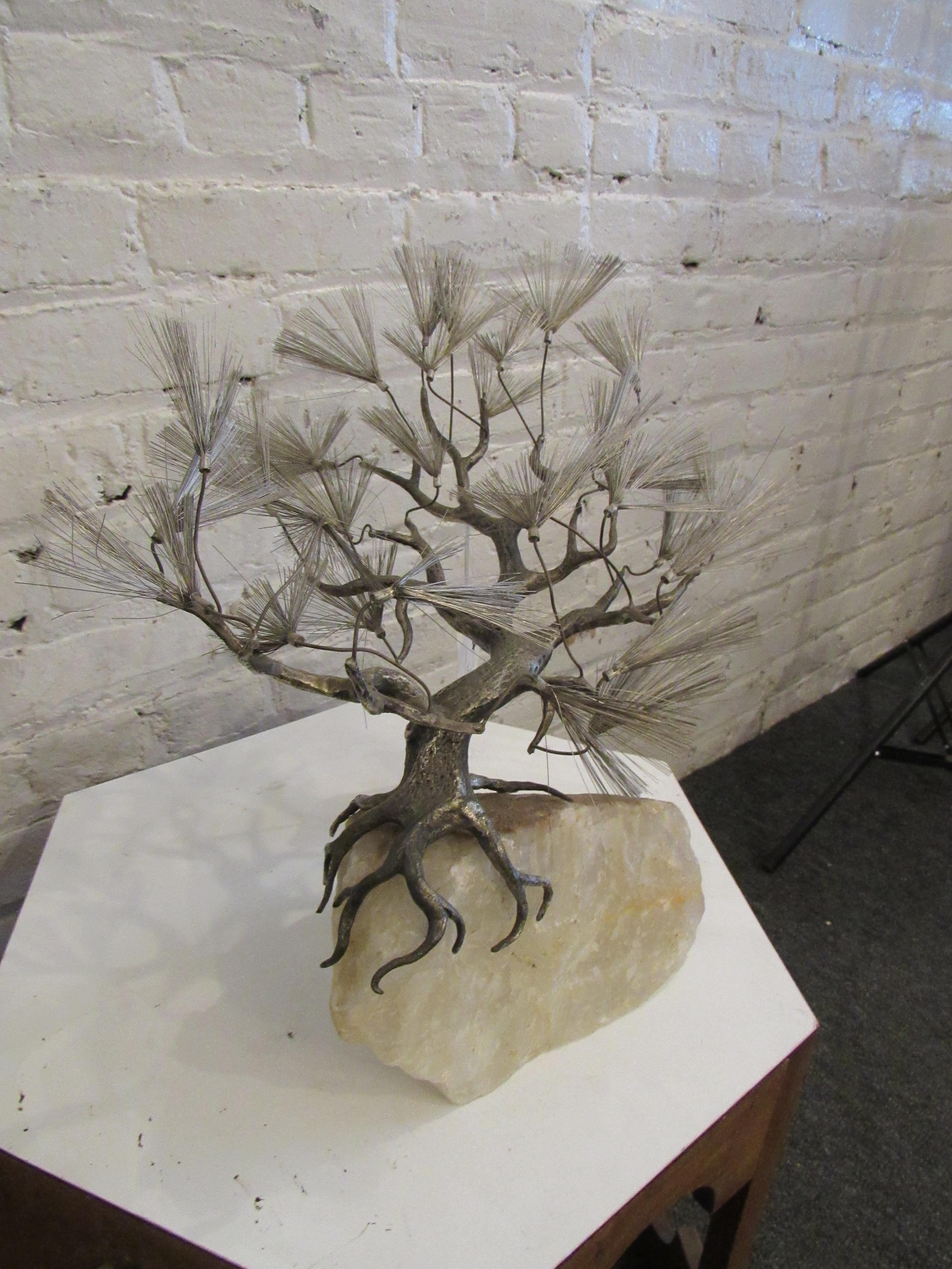 A vintage sculpture perfect for any table top or book shelf, this metal bonsai tree sits atop a hefty chunk of quartz. 
Please confirm item location with seller (NY/NJ).