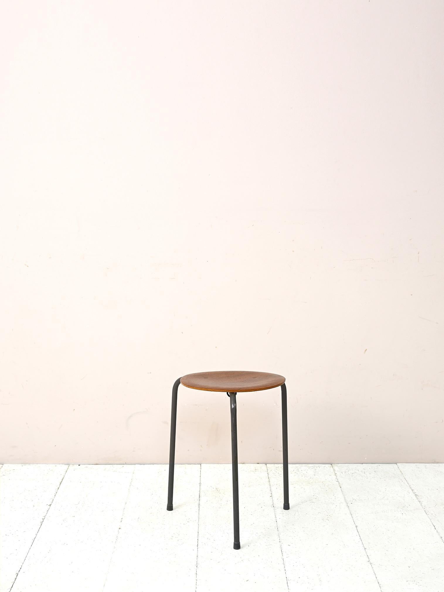 Scandinavian 1960s stool.
Consists of a tubular metal support frame and an upholstered seat made of teak wood veneer.A retro-looking piece of furniture to be used either as a seat or as a small table top.
Good condition. May show some signs of