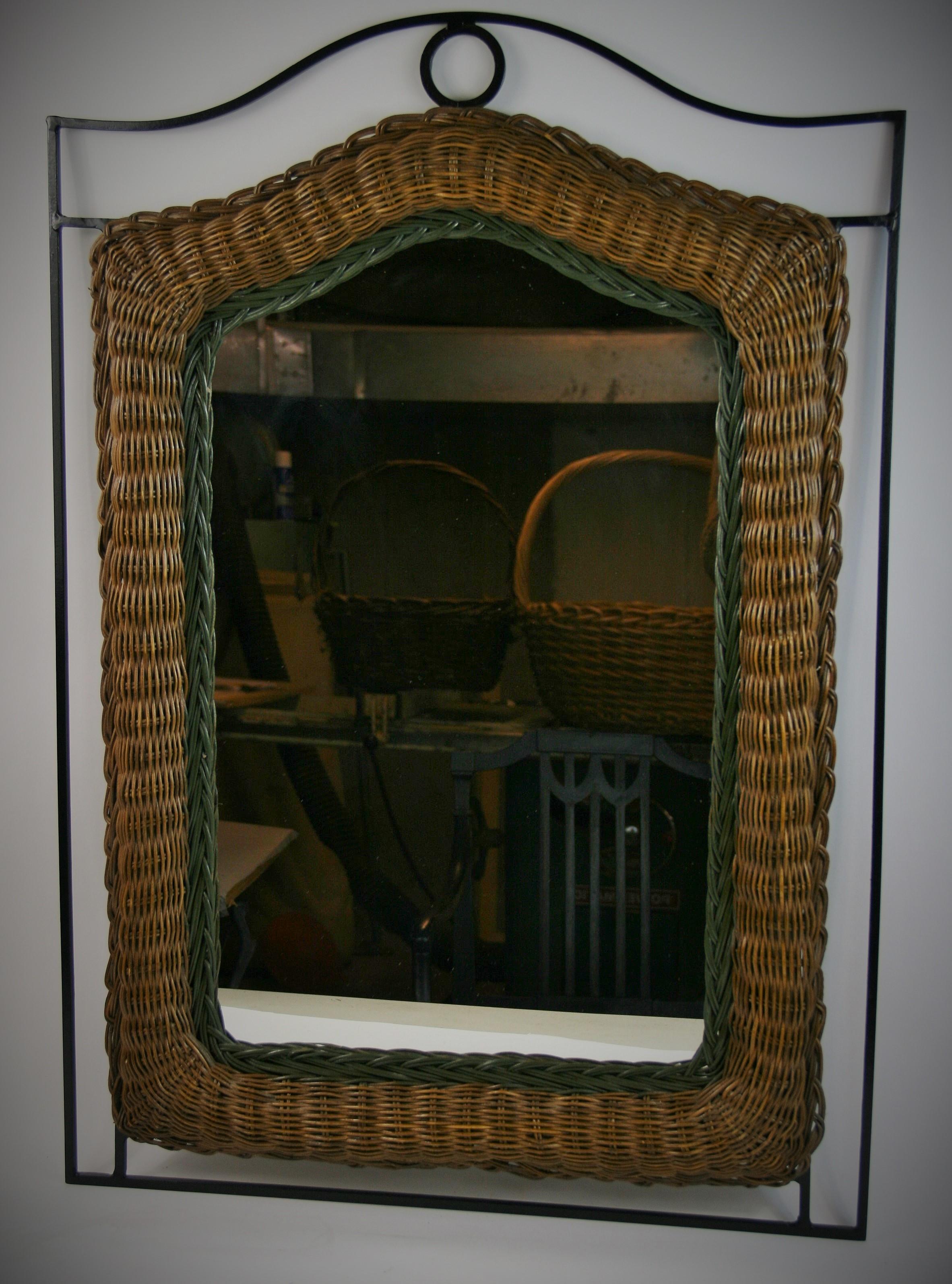 2-300 wicker mirror surrounded by handmade black iron border.
Dark wicker with dark green border around the mirror.